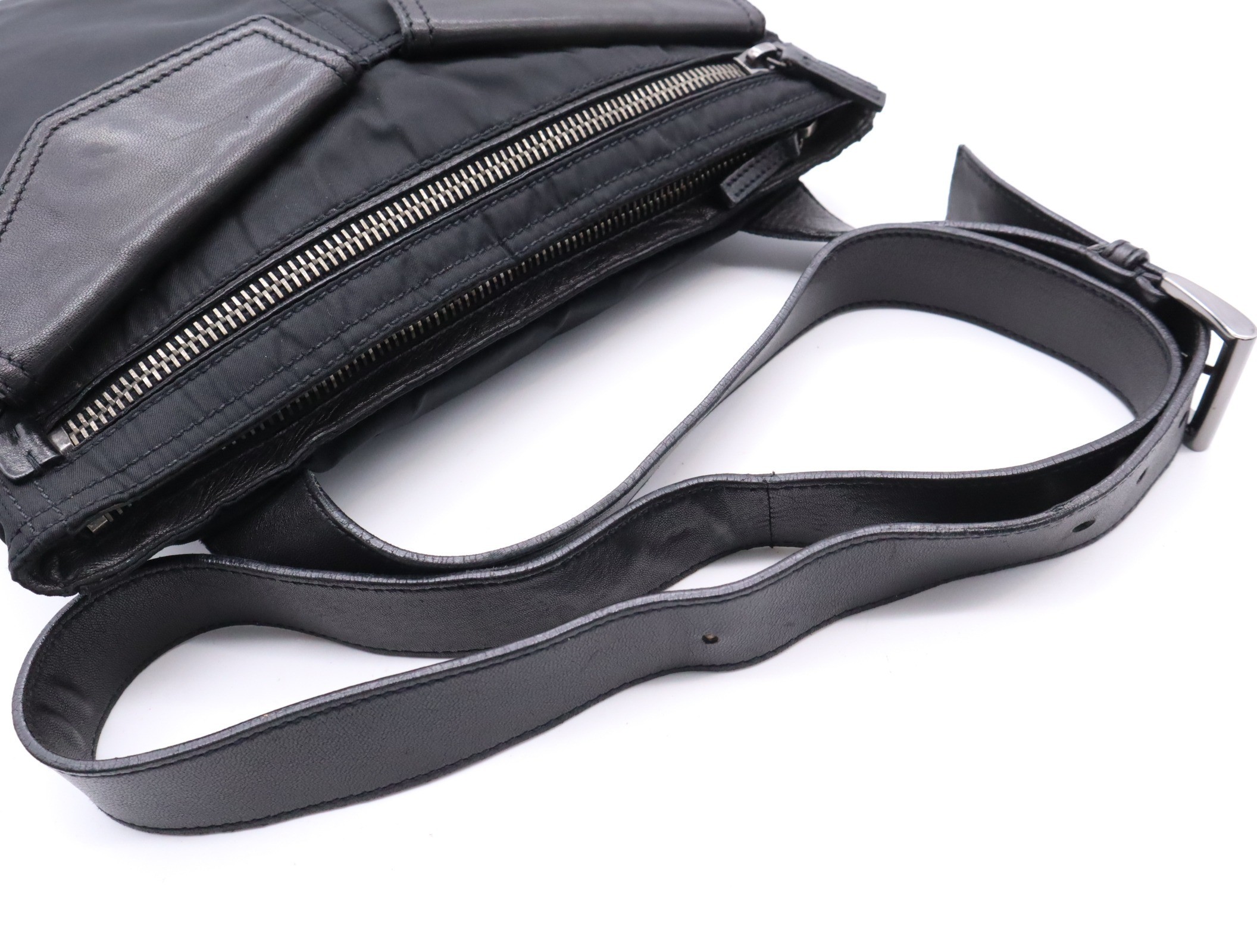 Nylon shoulder bag with triangular logo, black, silver hardware, and card included. — view 6