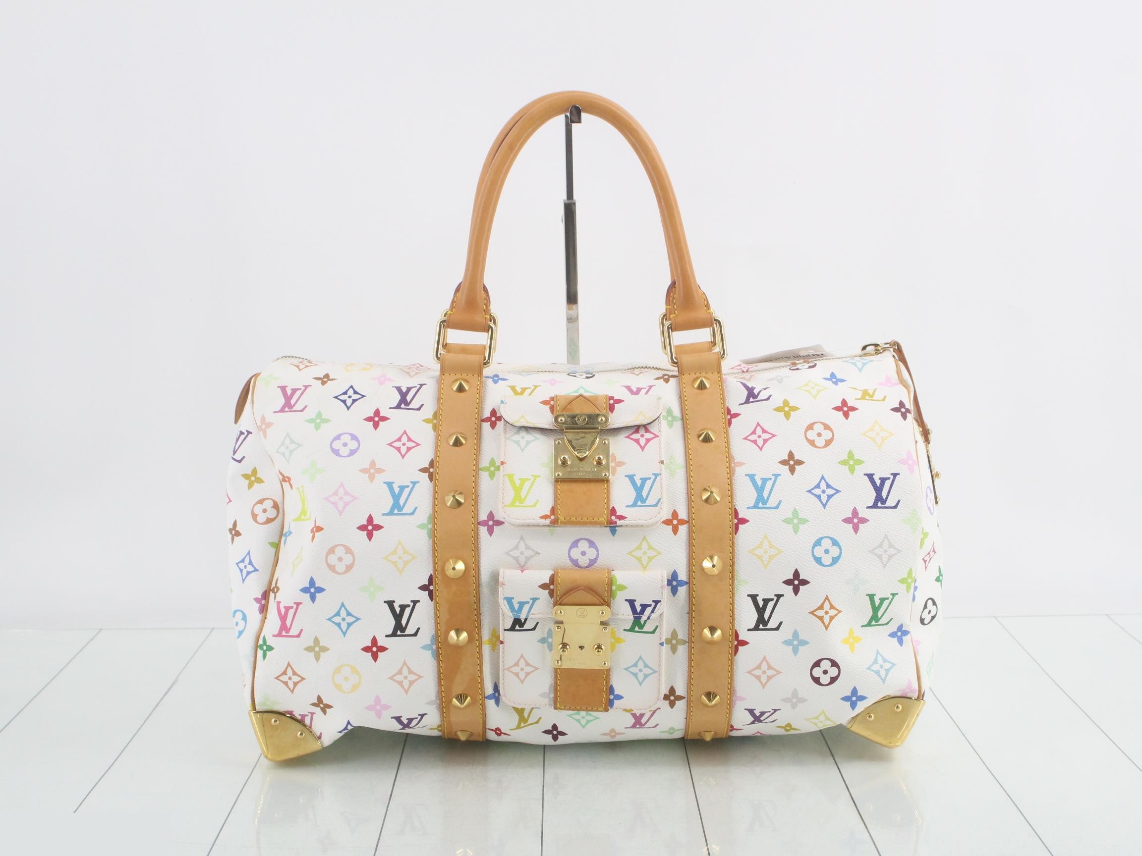 Keepall 45 Blanc, includes 2 keys, clochette, name tag, and handle strap.