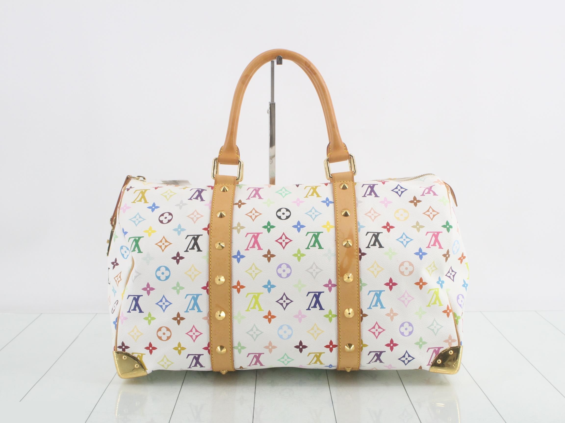 Keepall 45 Blanc, includes 2 keys, clochette, name tag, and handle strap. — view 2