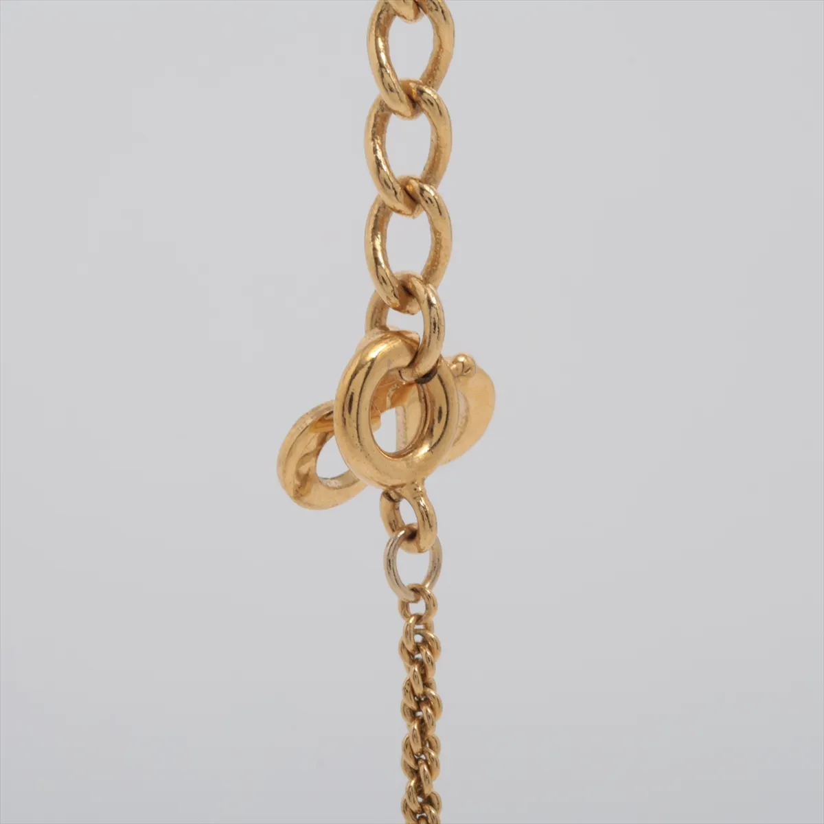 CD logo necklace, gold plated with rhinestones. Shows signs of wear, tarnishing, — view 3