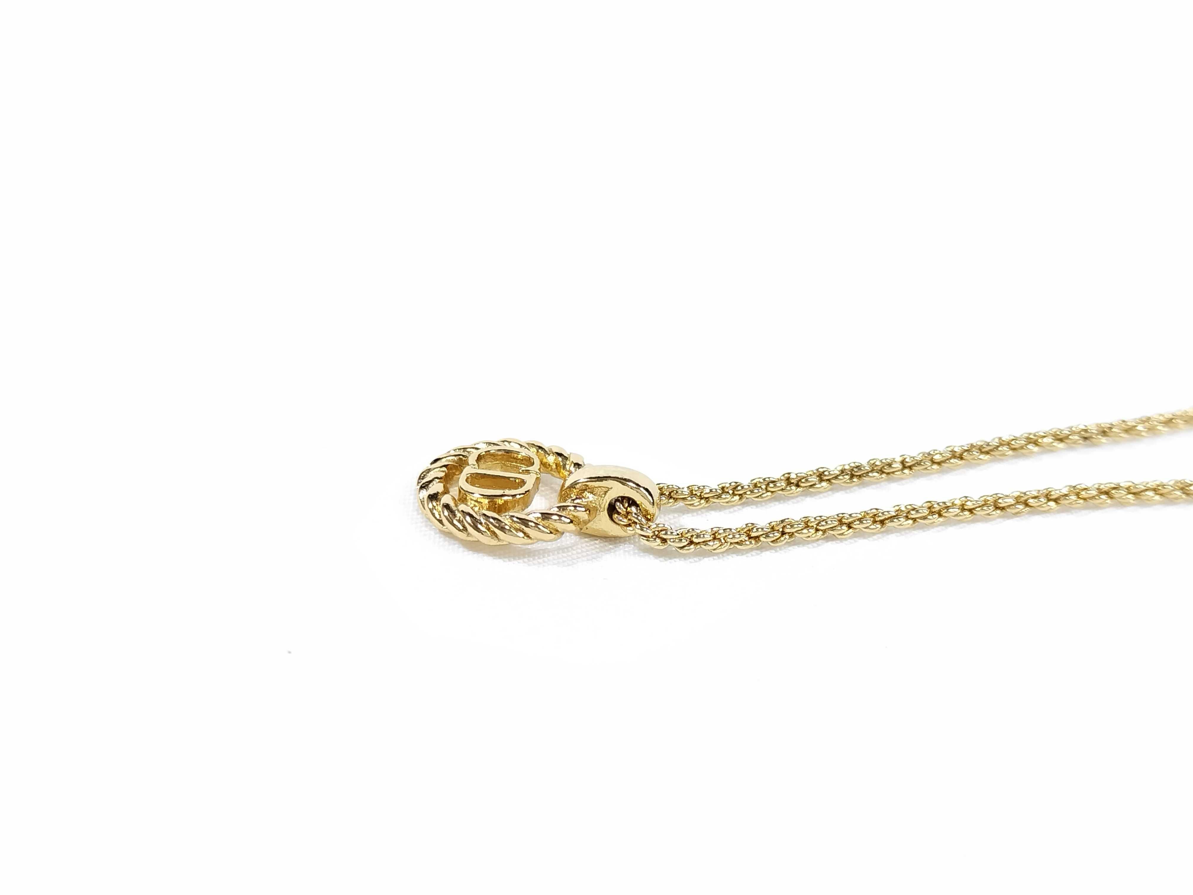gold-colored necklace and other accessories — view 2