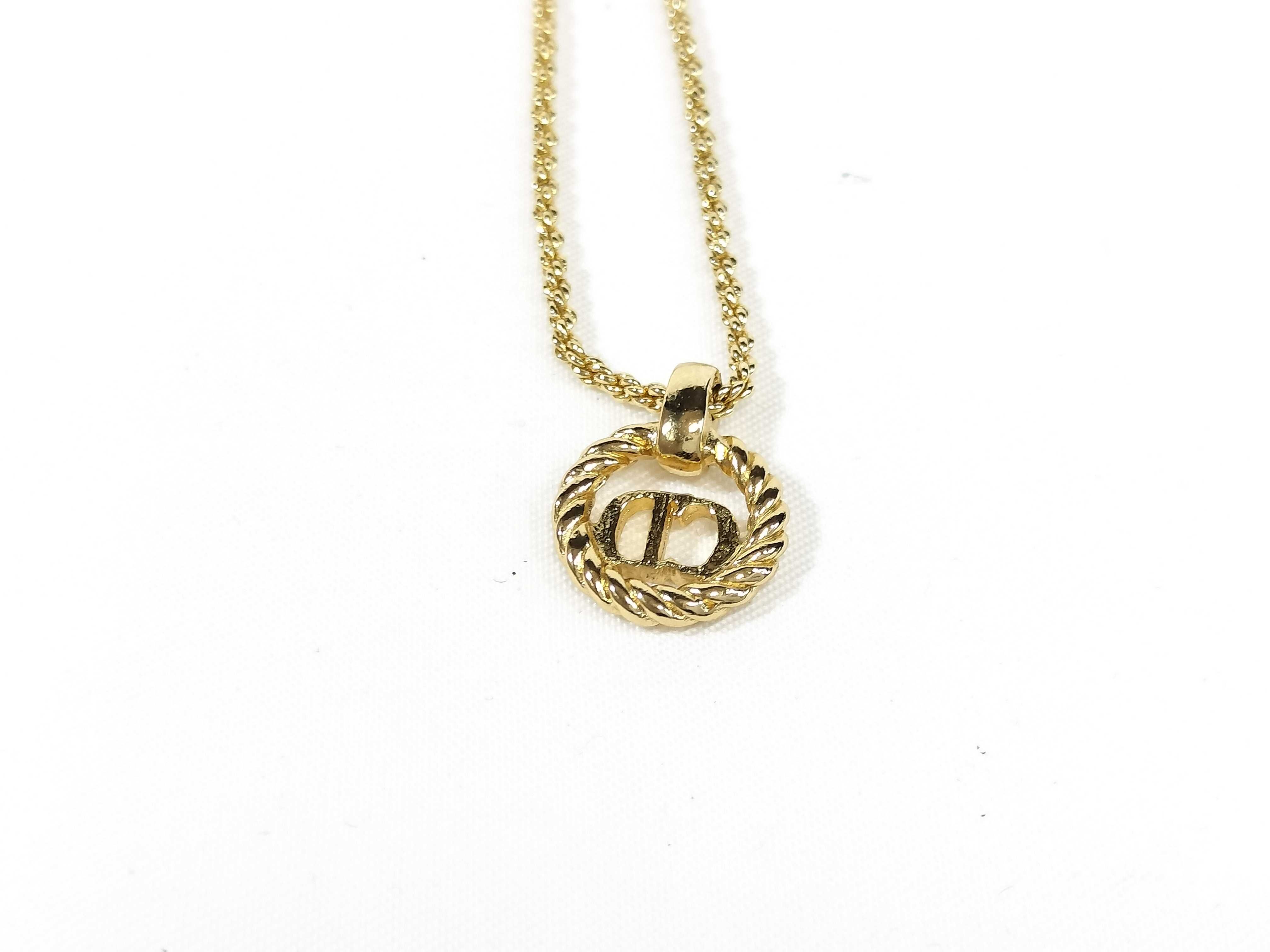 gold-colored necklace and other accessories — view 3