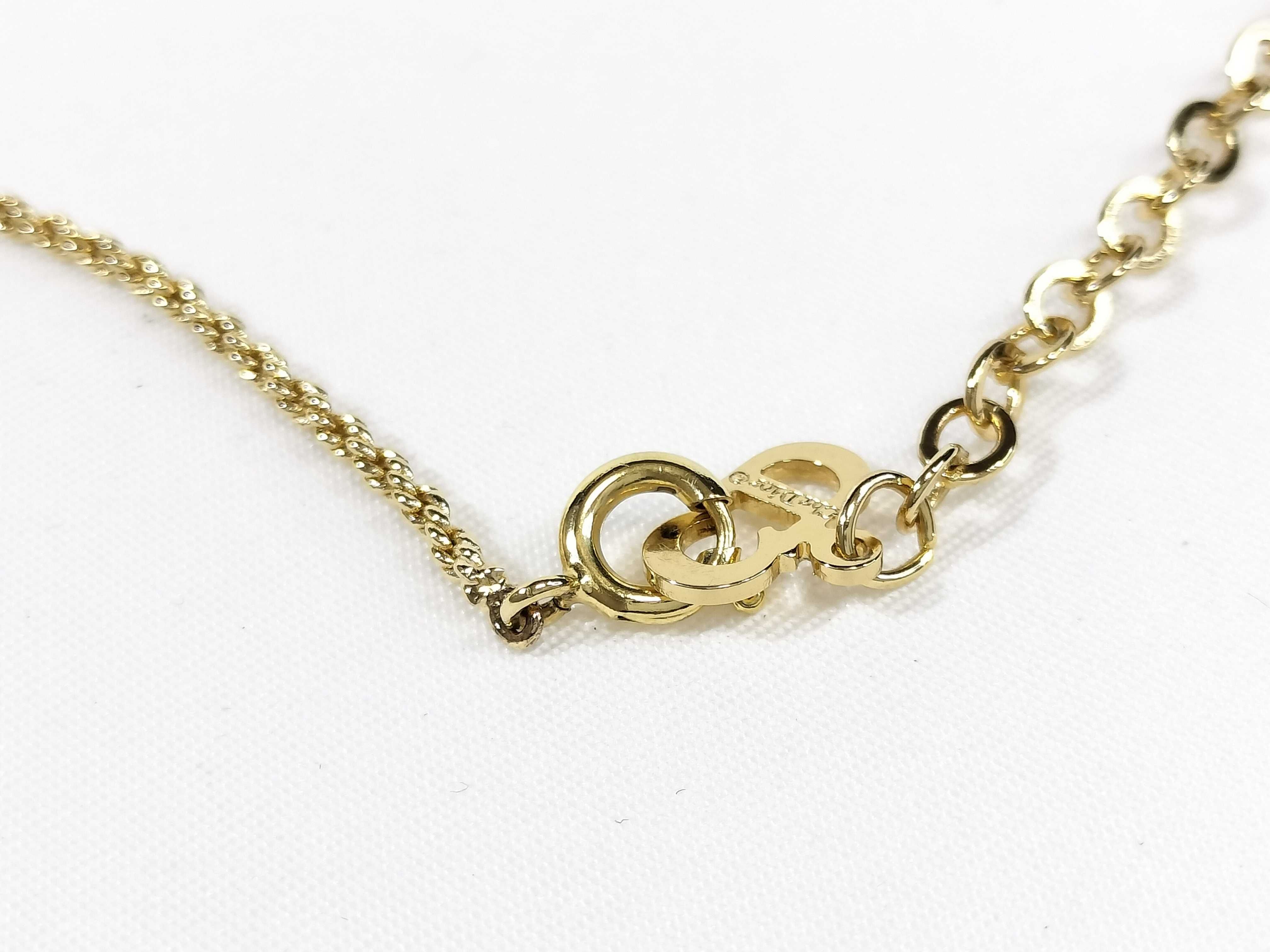 gold-colored necklace and other accessories — view 4