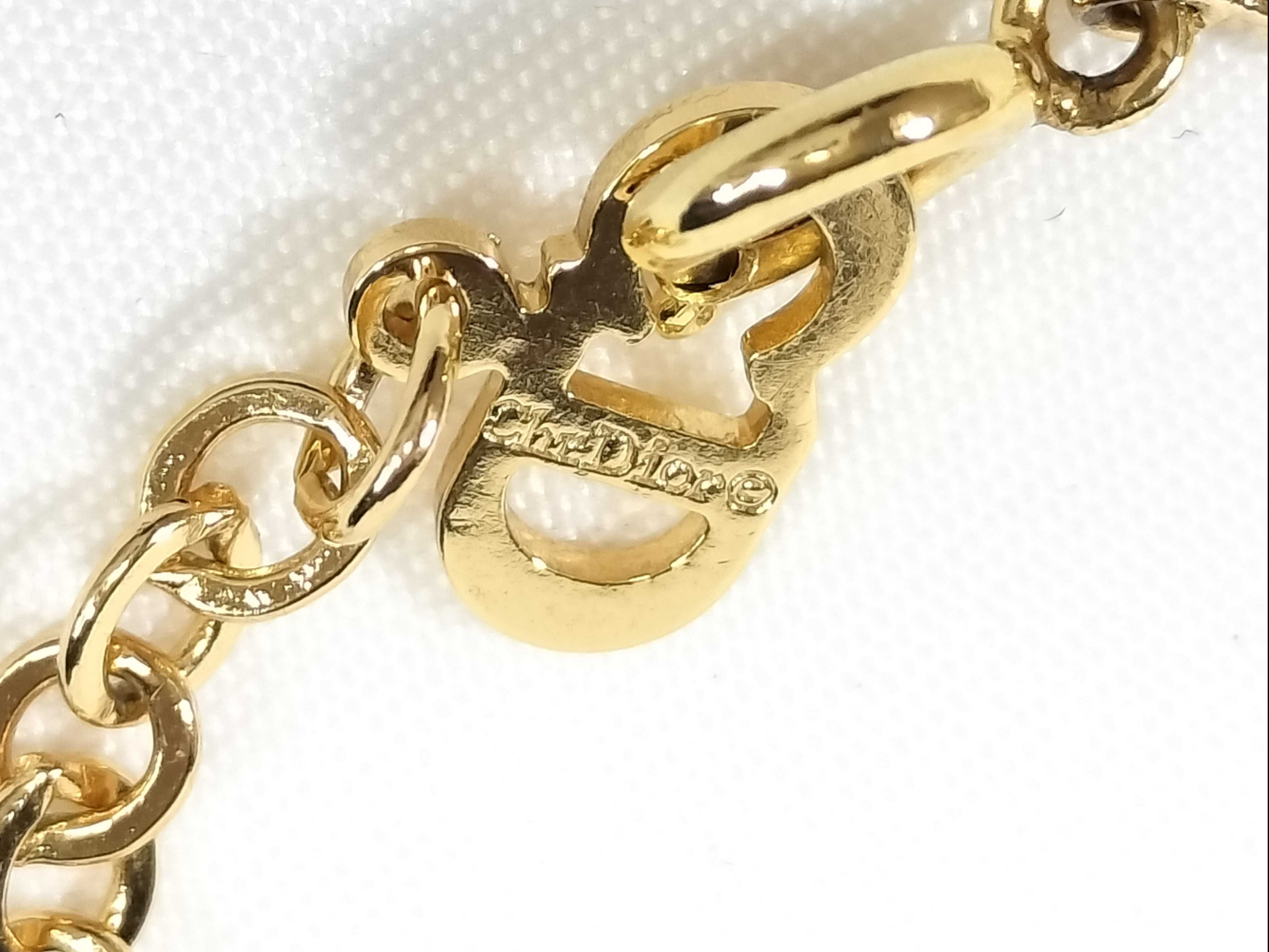 gold-colored necklace and other accessories — view 5