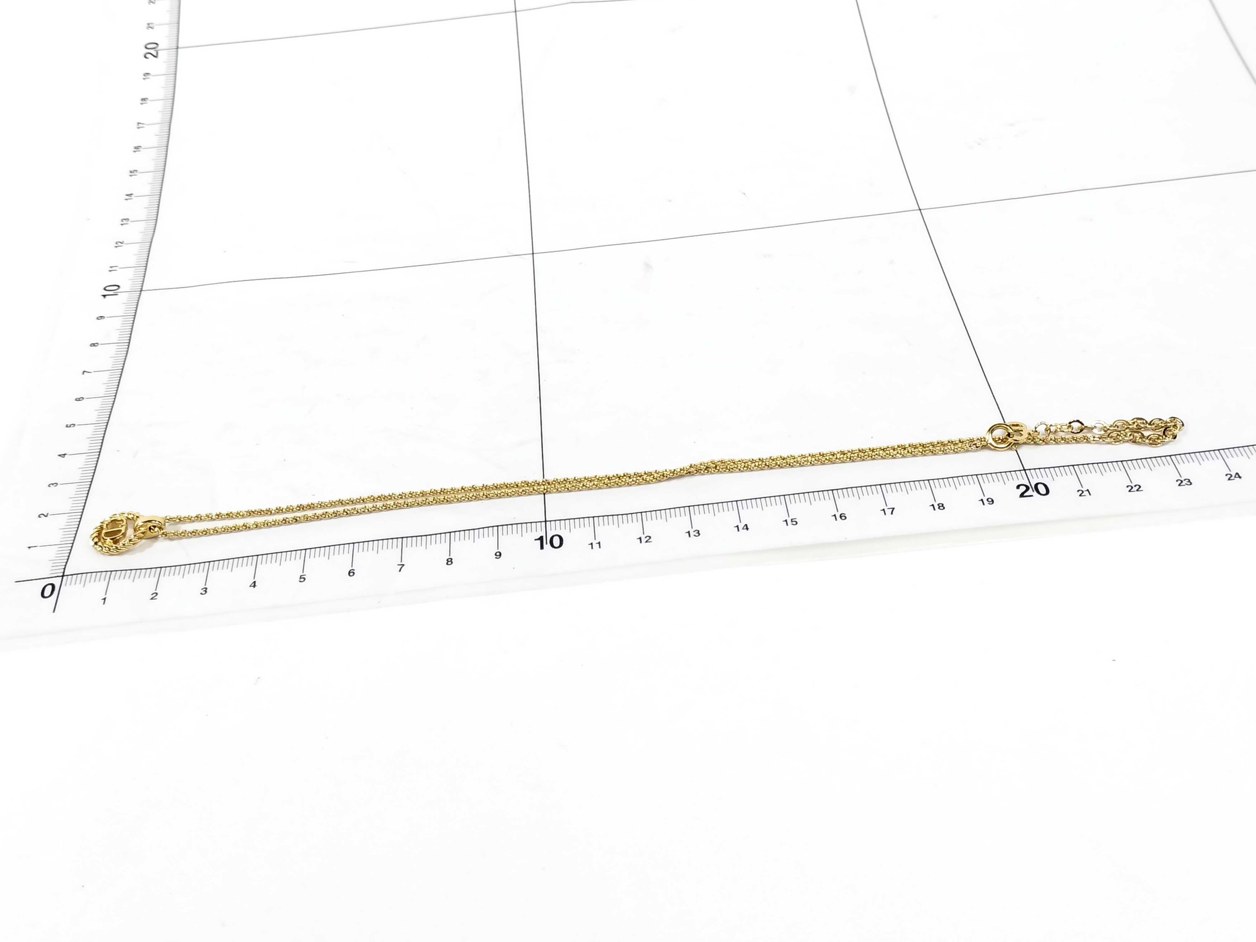 gold-colored necklace and other accessories — view 6