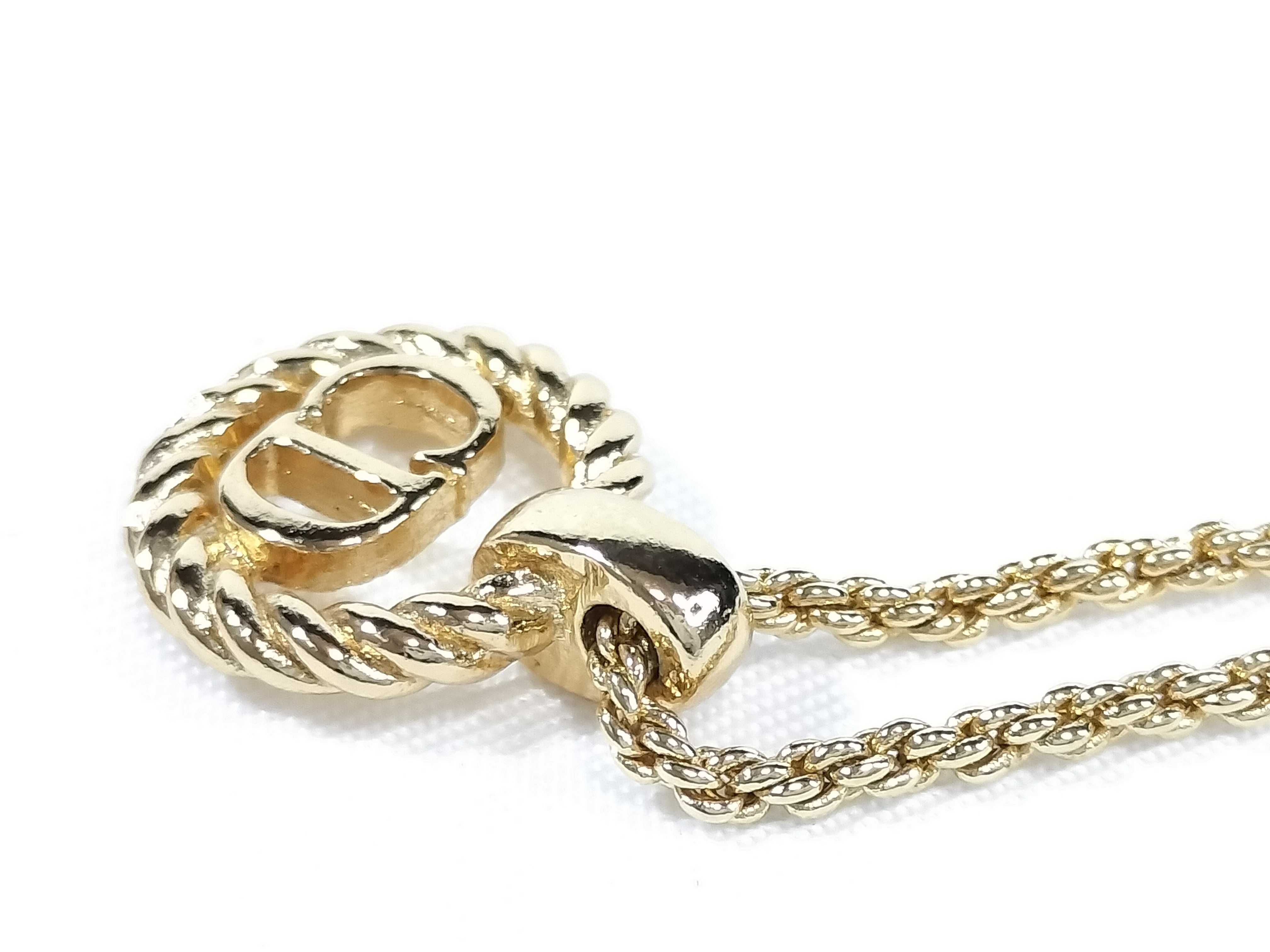 gold-colored necklace and other accessories — view 8