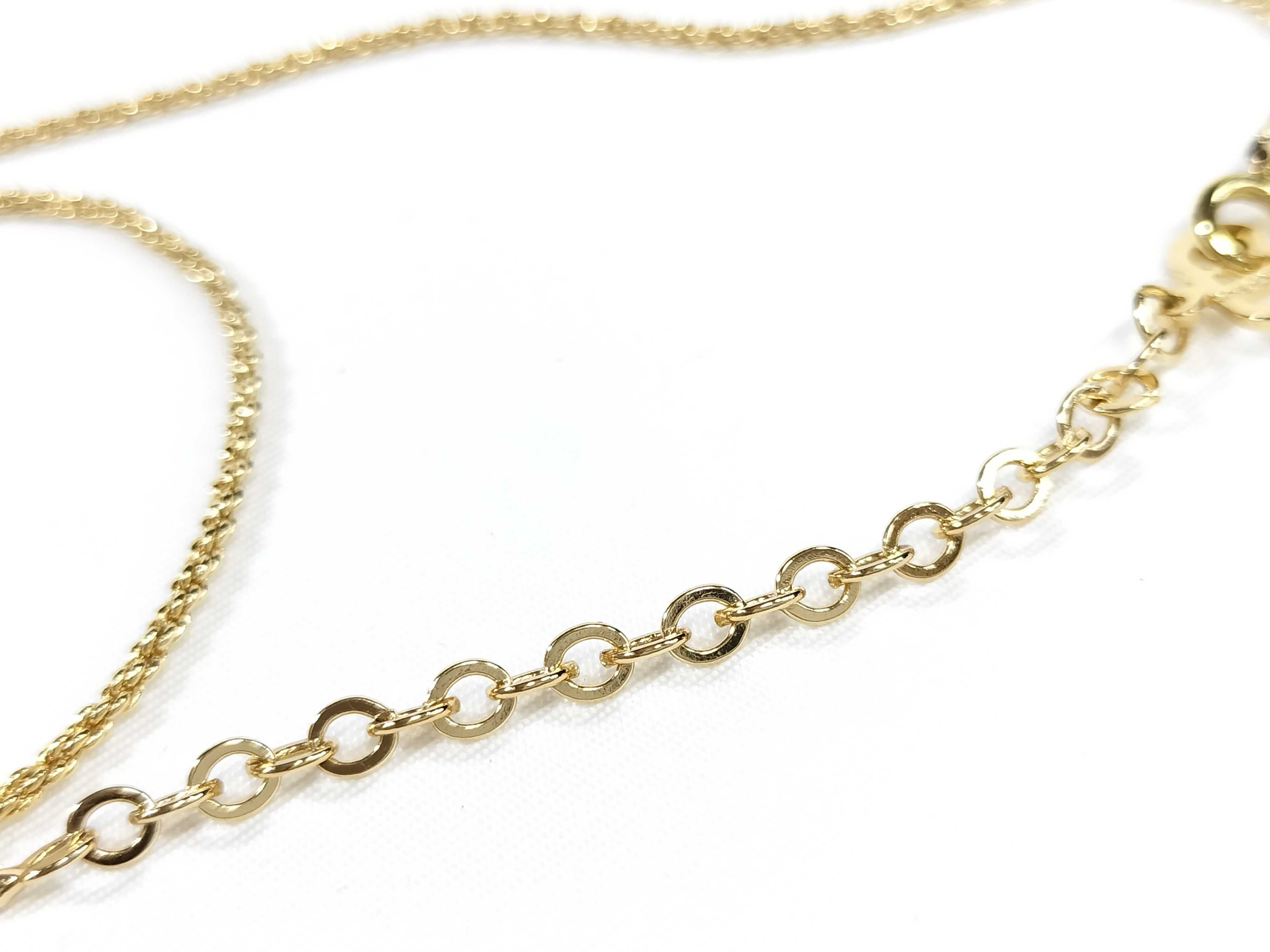 gold-colored necklace and other accessories — view 9