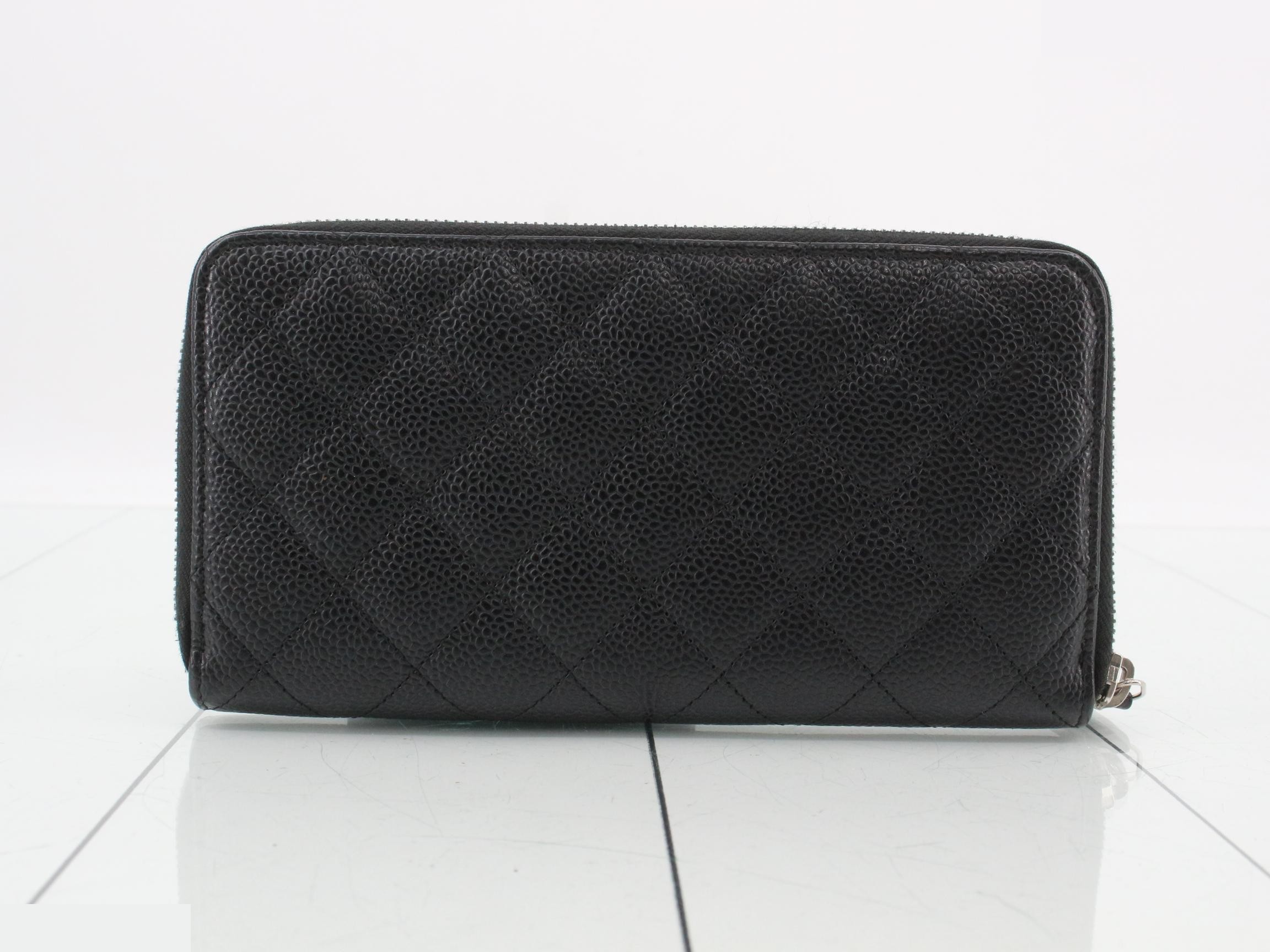 Caviar leather long wallet, serial number in the 25 range, includes guarantee card, dust bag, box, and instruction manual. — view 2