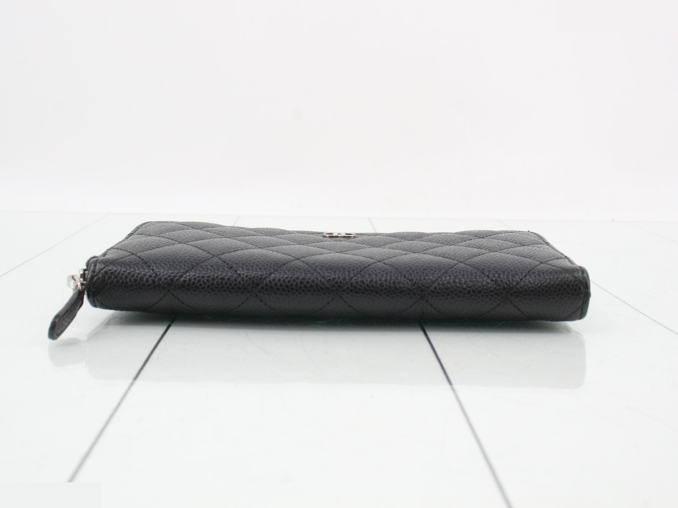 Caviar leather long wallet, serial number in the 25 range, includes guarantee card, dust bag, box, and instruction manual. — view 3