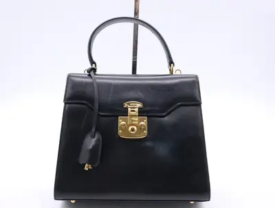 Leather Lady Lock handbag with clochette and 2 keys, black with gold hardware.
