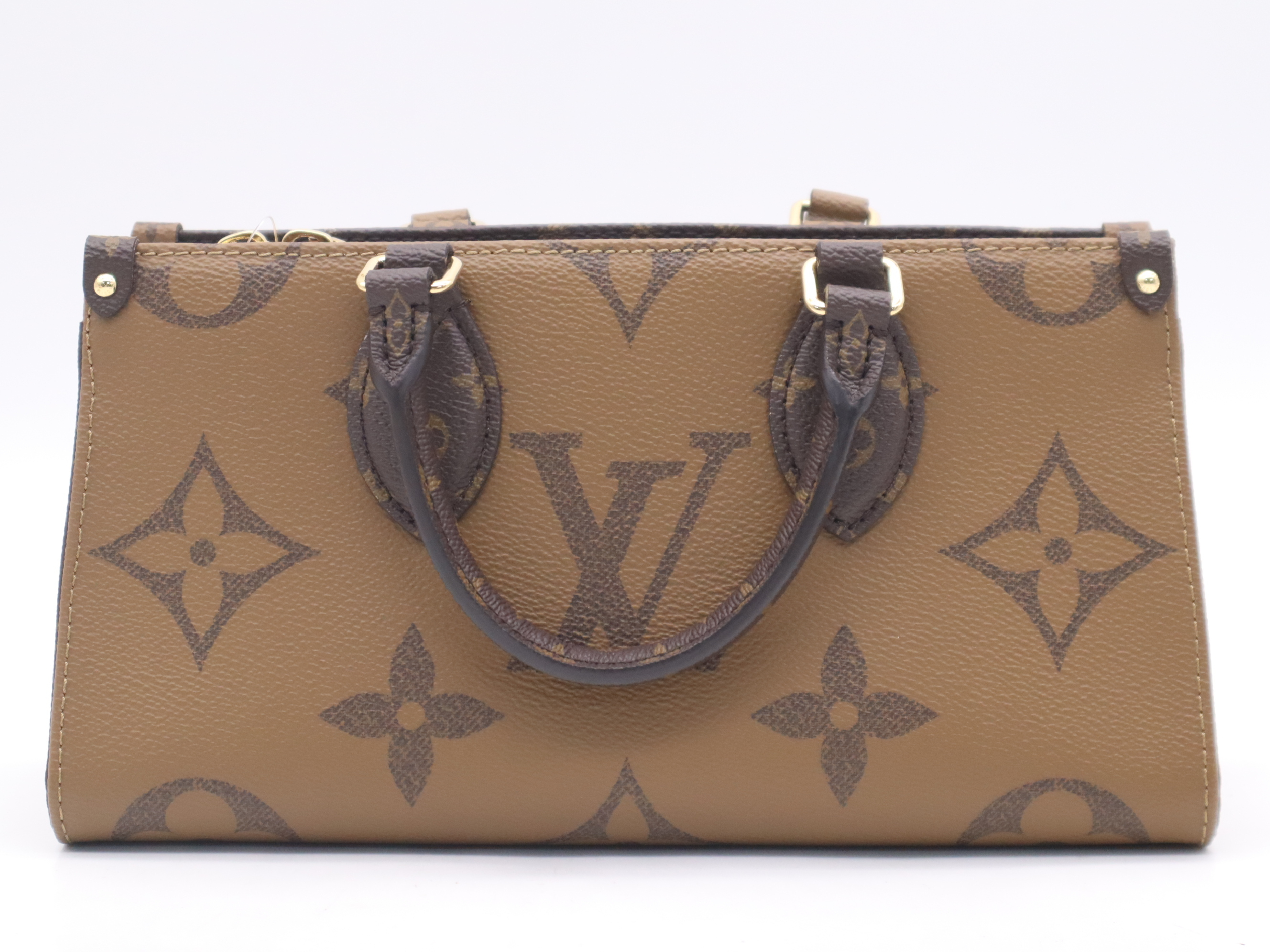 M46653 Monogram Giant Reverse On The Go EW Handbag with Shoulder Strap, Dust Bag, and Pouch — view 2