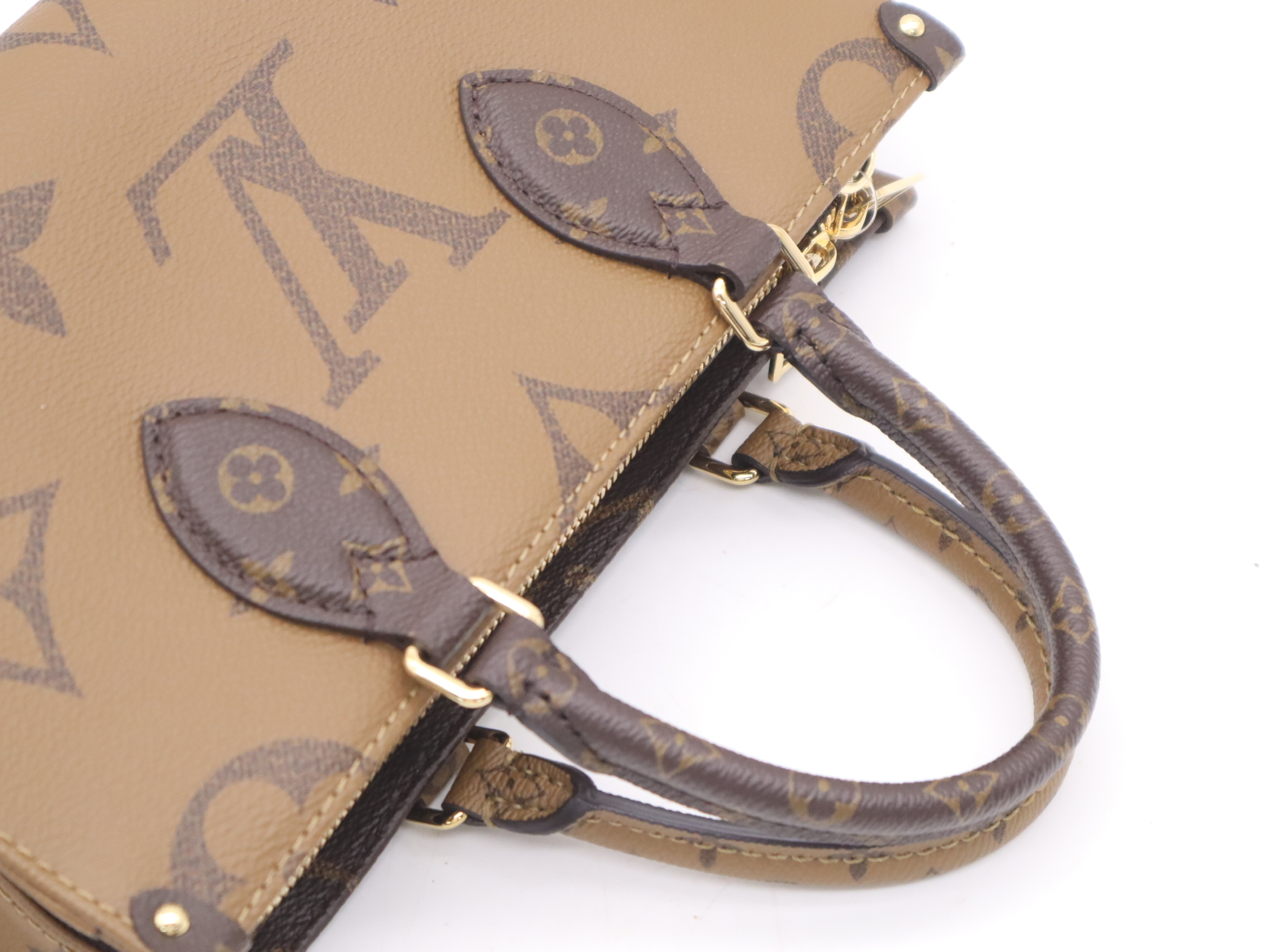 M46653 Monogram Giant Reverse On The Go EW Handbag with Shoulder Strap, Dust Bag, and Pouch — view 6