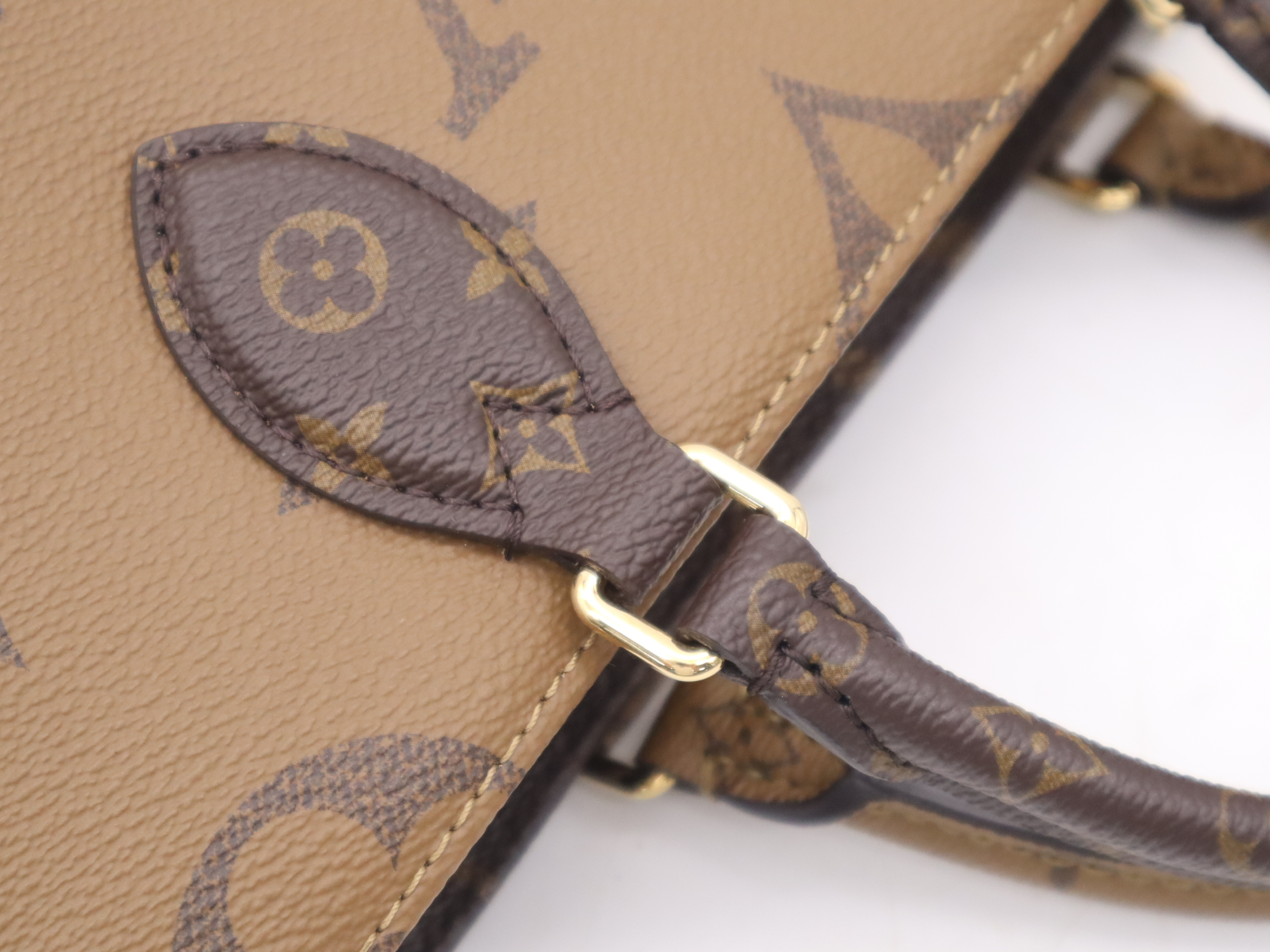 M46653 Monogram Giant Reverse On The Go EW Handbag with Shoulder Strap, Dust Bag, and Pouch — view 7