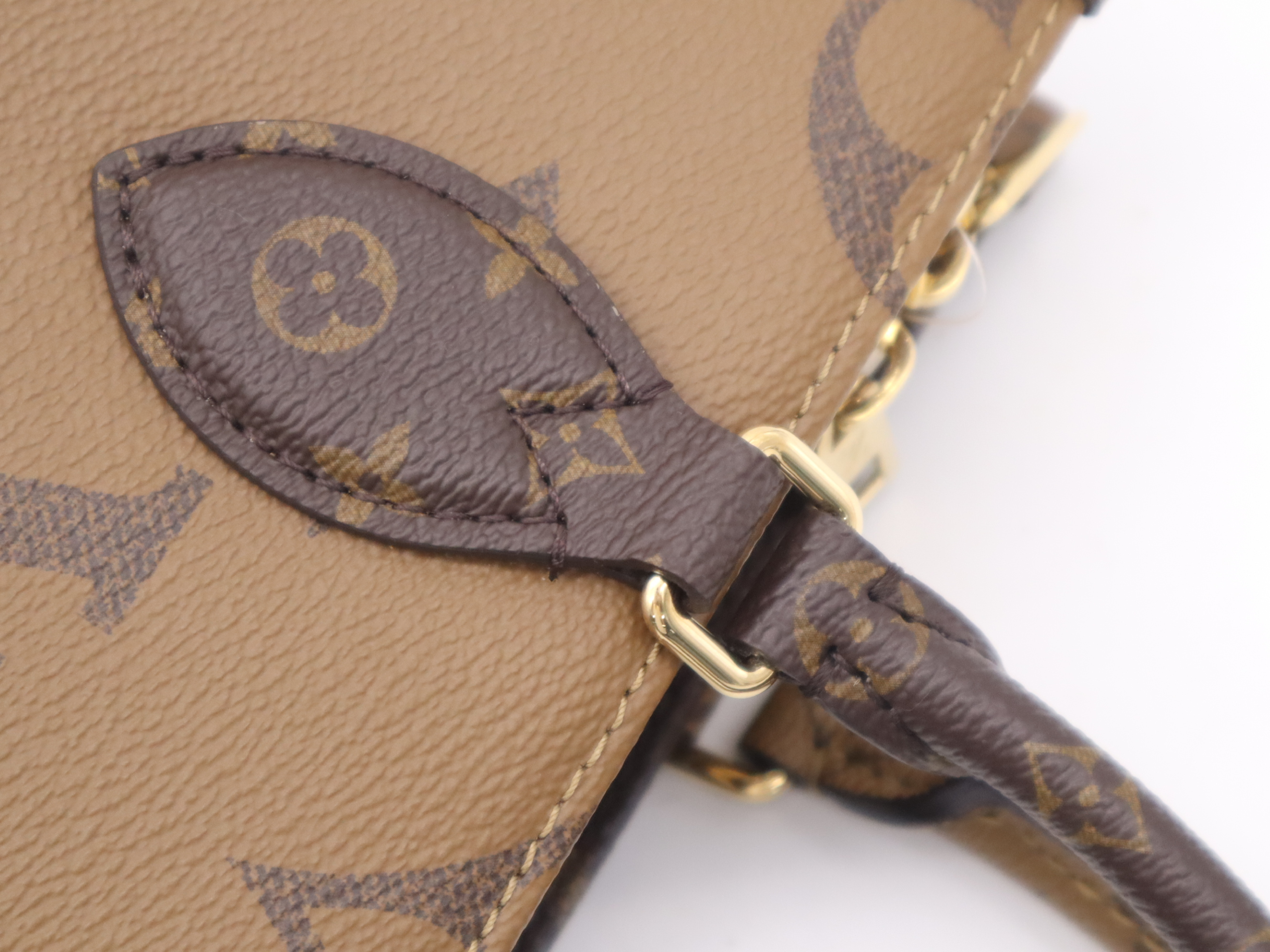 M46653 Monogram Giant Reverse On The Go EW Handbag with Shoulder Strap, Dust Bag, and Pouch — view 8