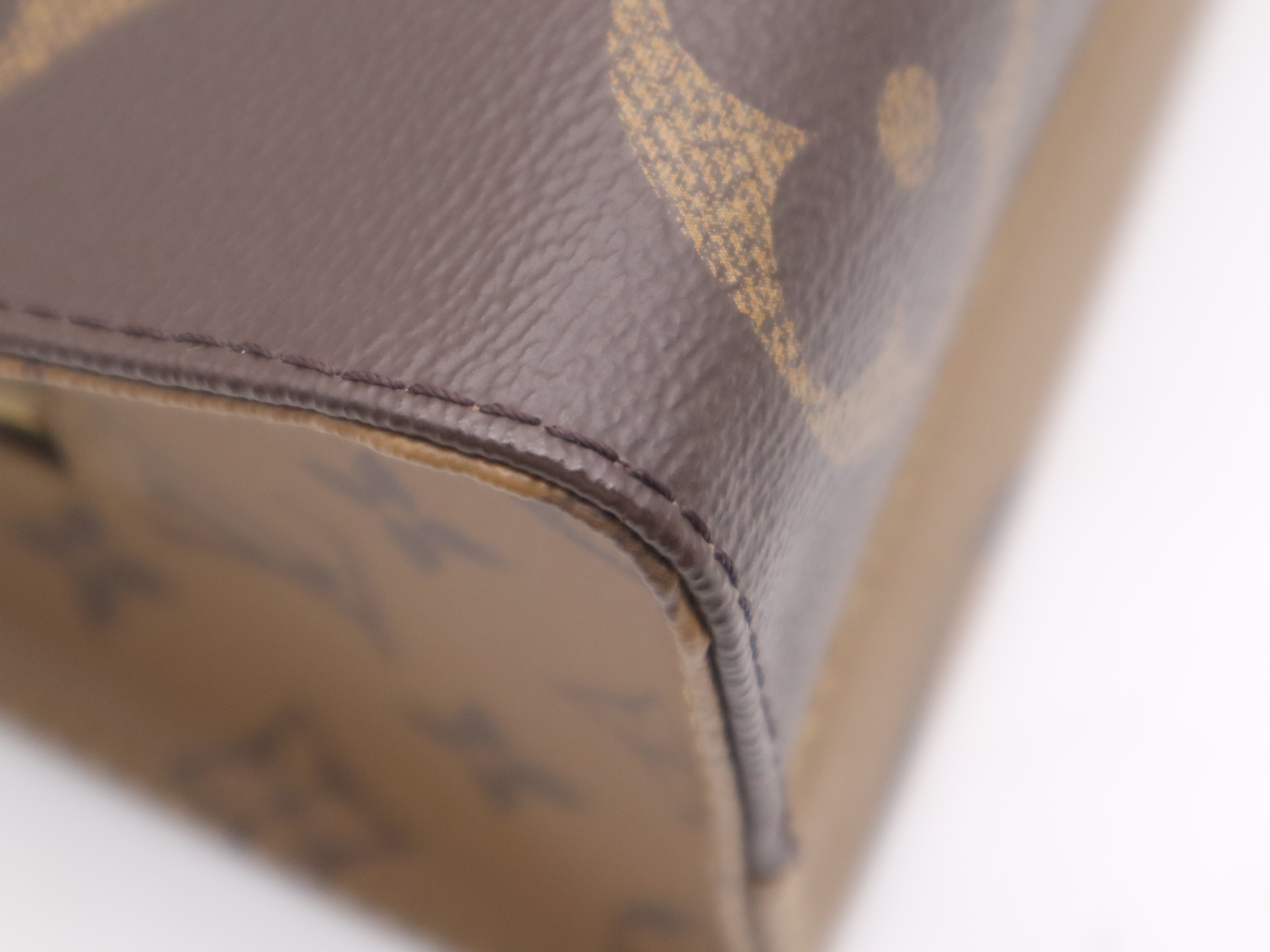 M46653 Monogram Giant Reverse On The Go EW Handbag with Shoulder Strap, Dust Bag, and Pouch — view 9