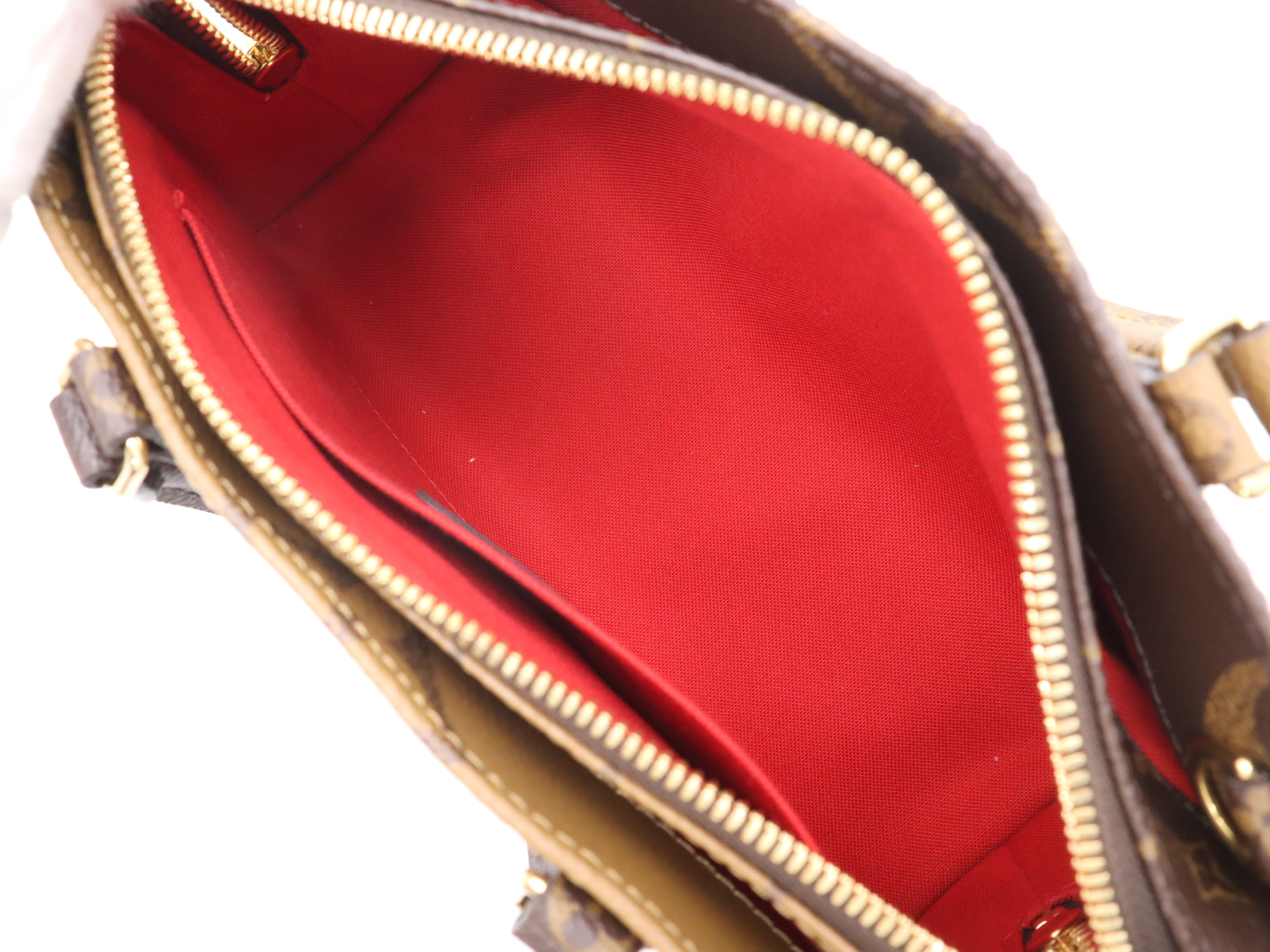 M46653 Monogram Giant Reverse On The Go EW Handbag with Shoulder Strap, Dust Bag, and Pouch — view 10