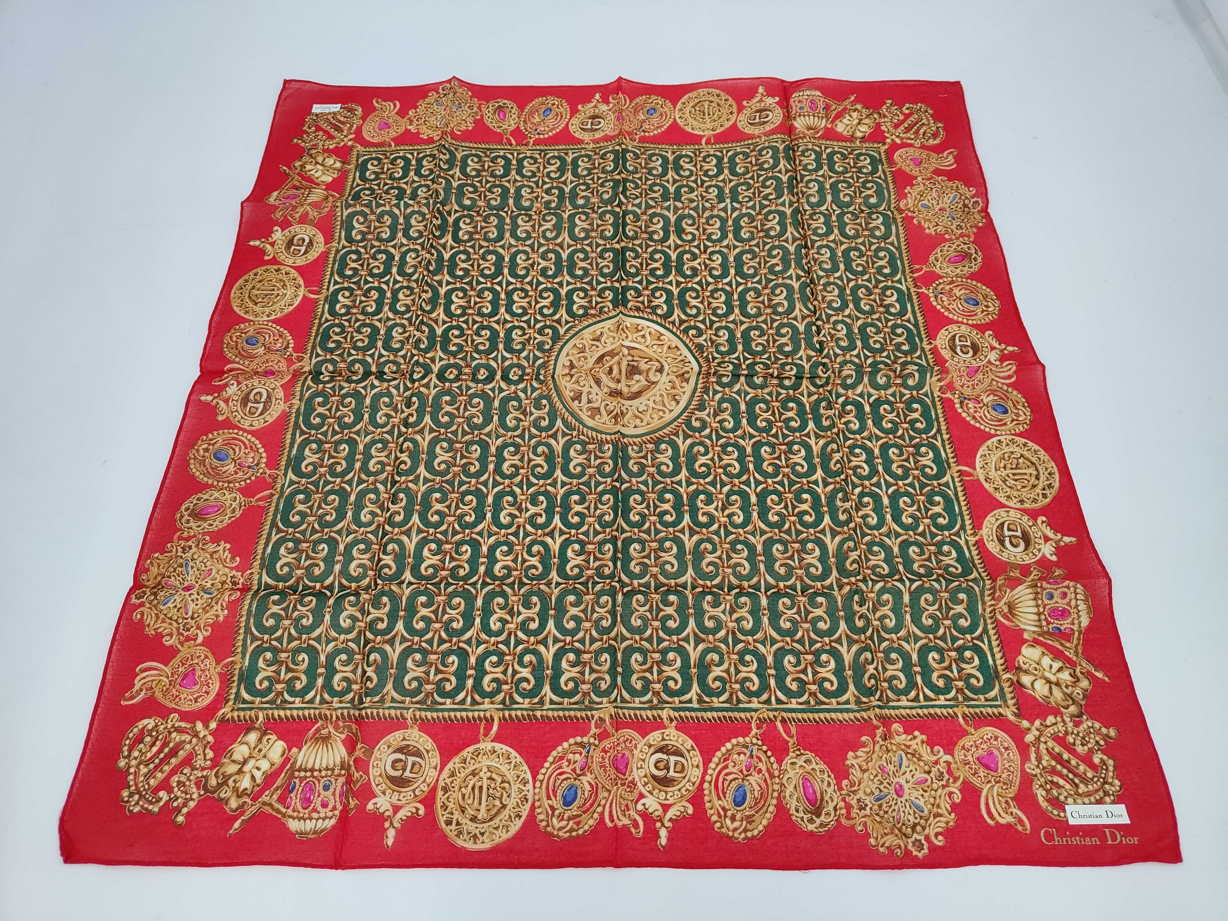 handkerchief scarf with sticker, logo, emblem, jewel pattern, heart, and other accessories.