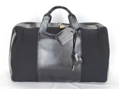(Tom Ford era archive) leather Boston bag with jacquard lining, key, padlock, G hardware, and name tag.