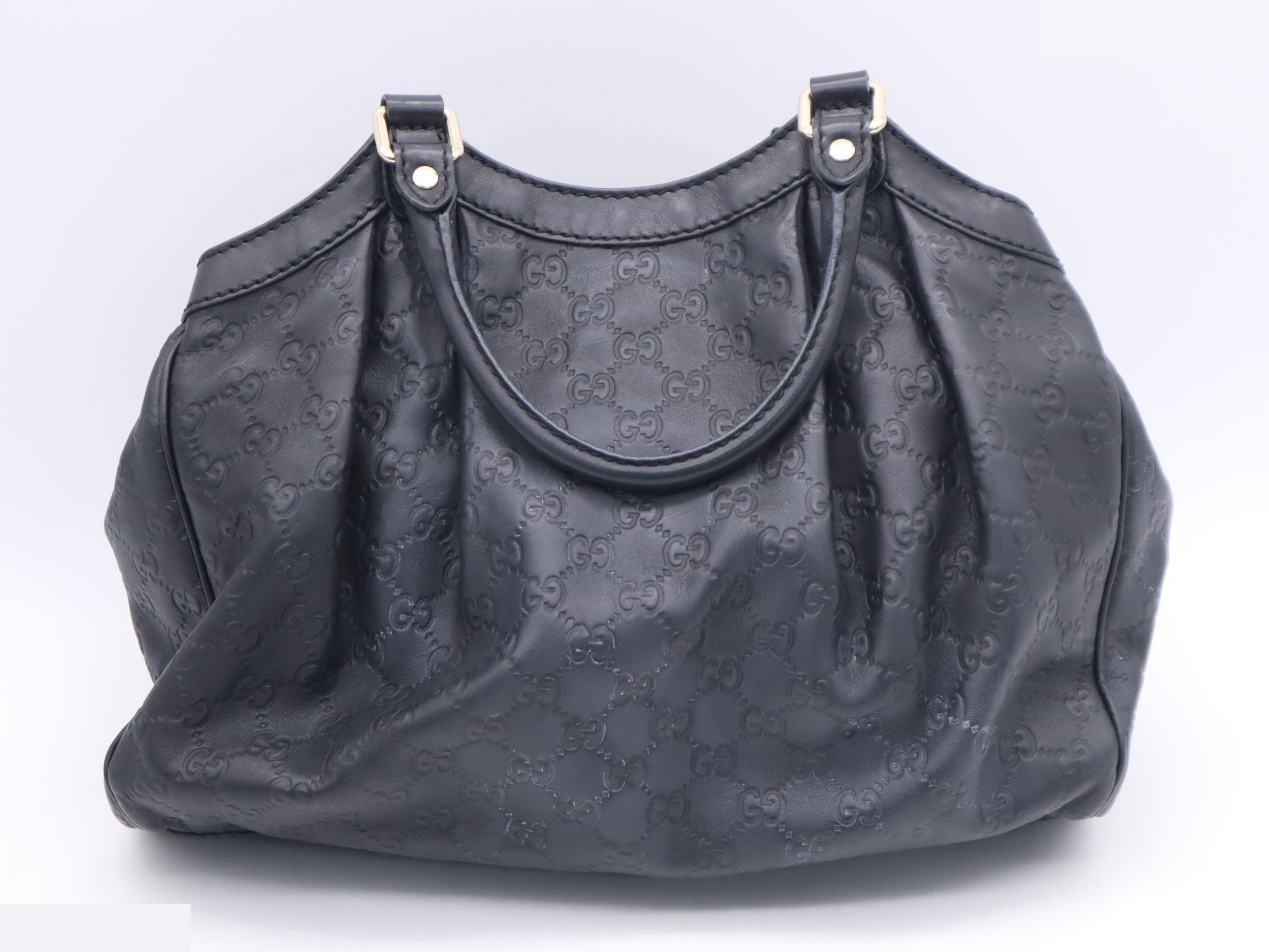 Handbag, black, gold hardware, with charm. — view 2