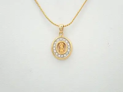 necklace/pendant with rhinestones; neck circumference approximately 48cm.