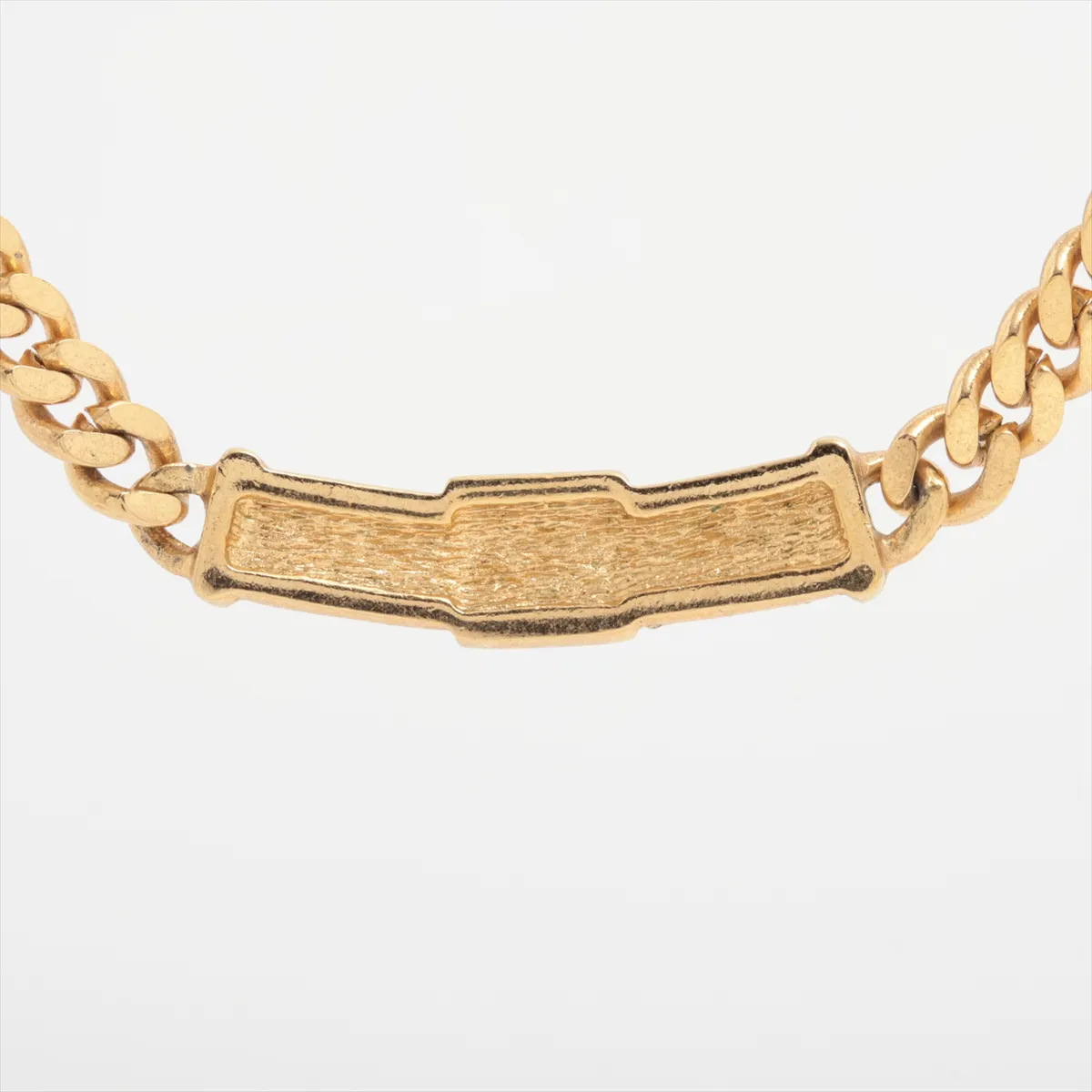 CD logo necklace, gold plated with rhinestones. Shows signs of wear, including — view 2