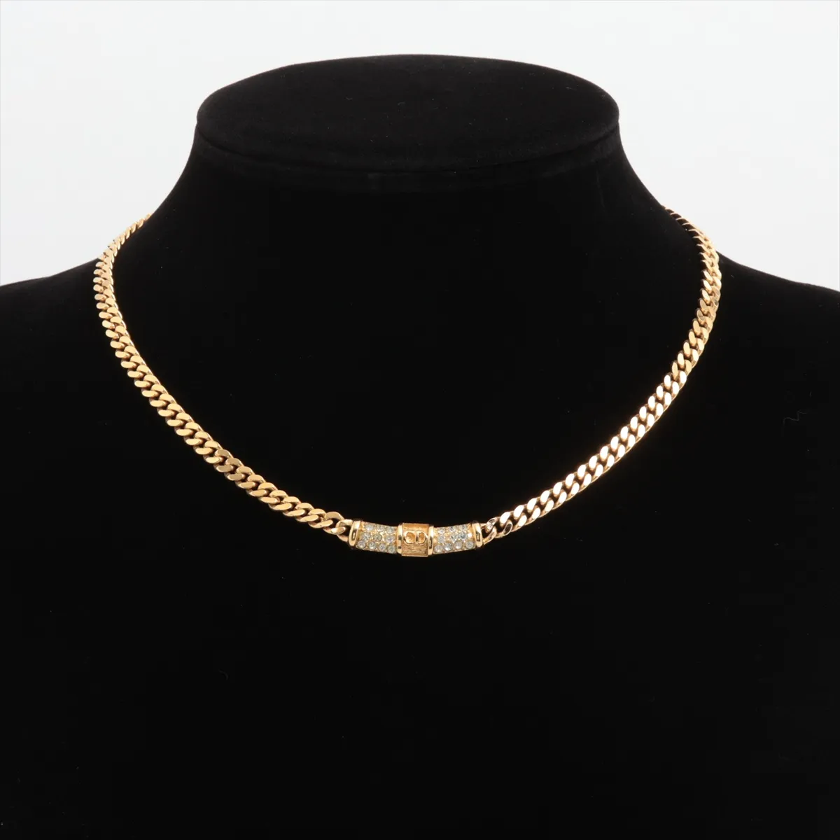 CD logo necklace, gold plated with rhinestones. Shows signs of wear, including — view 5