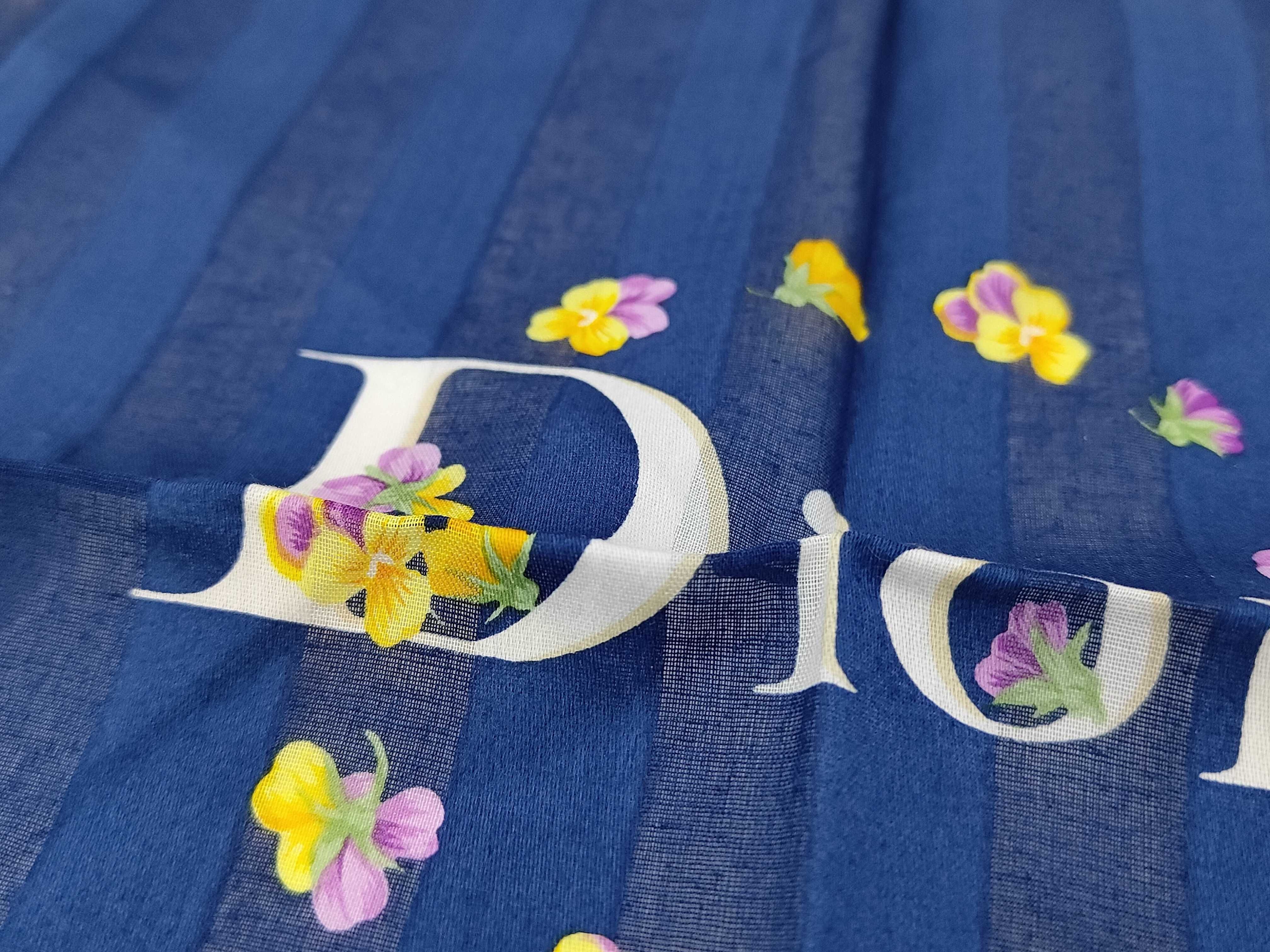 handkerchief scarf with sticker, logo, floral pattern, ribbon, navy, and other accessories. — view 4