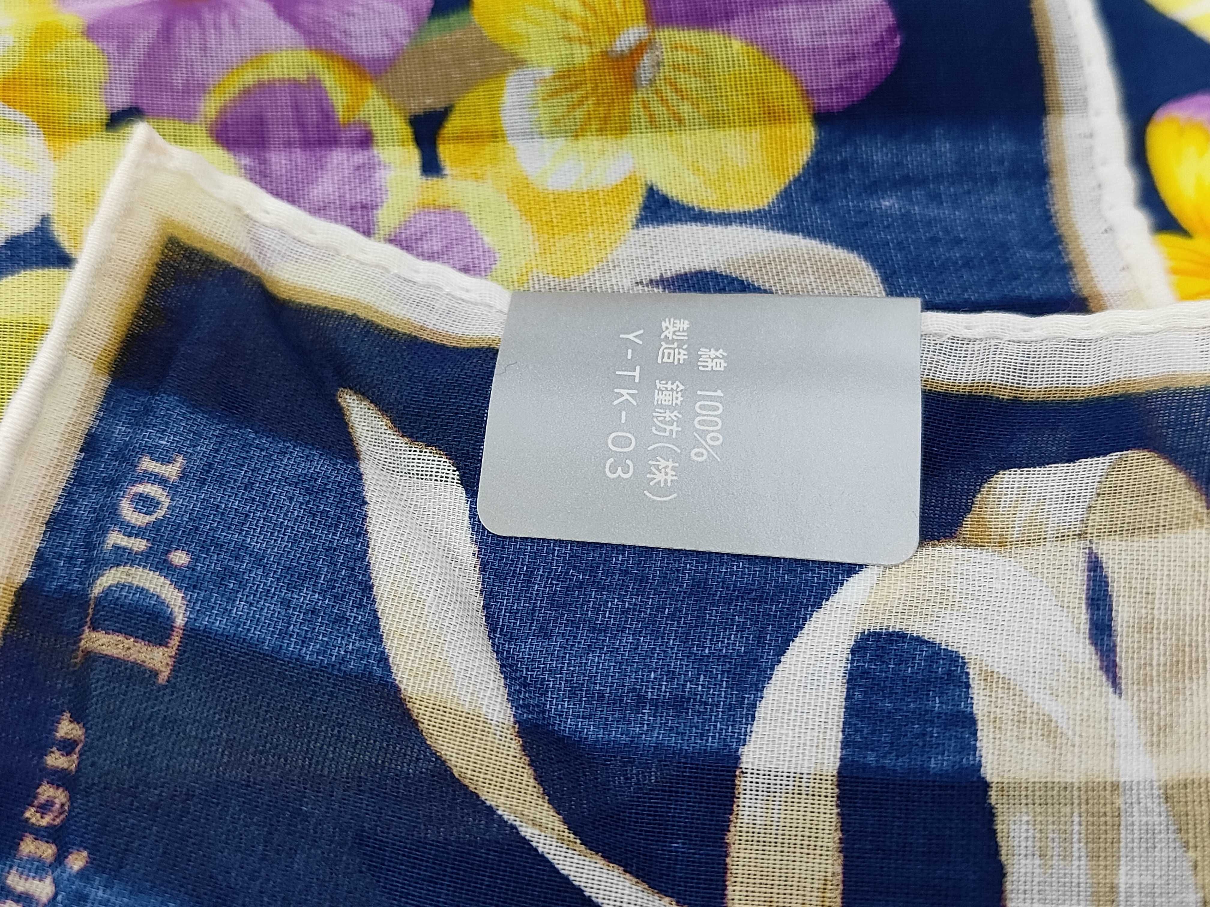 handkerchief scarf with sticker, logo, floral pattern, ribbon, navy, and other accessories. — view 6