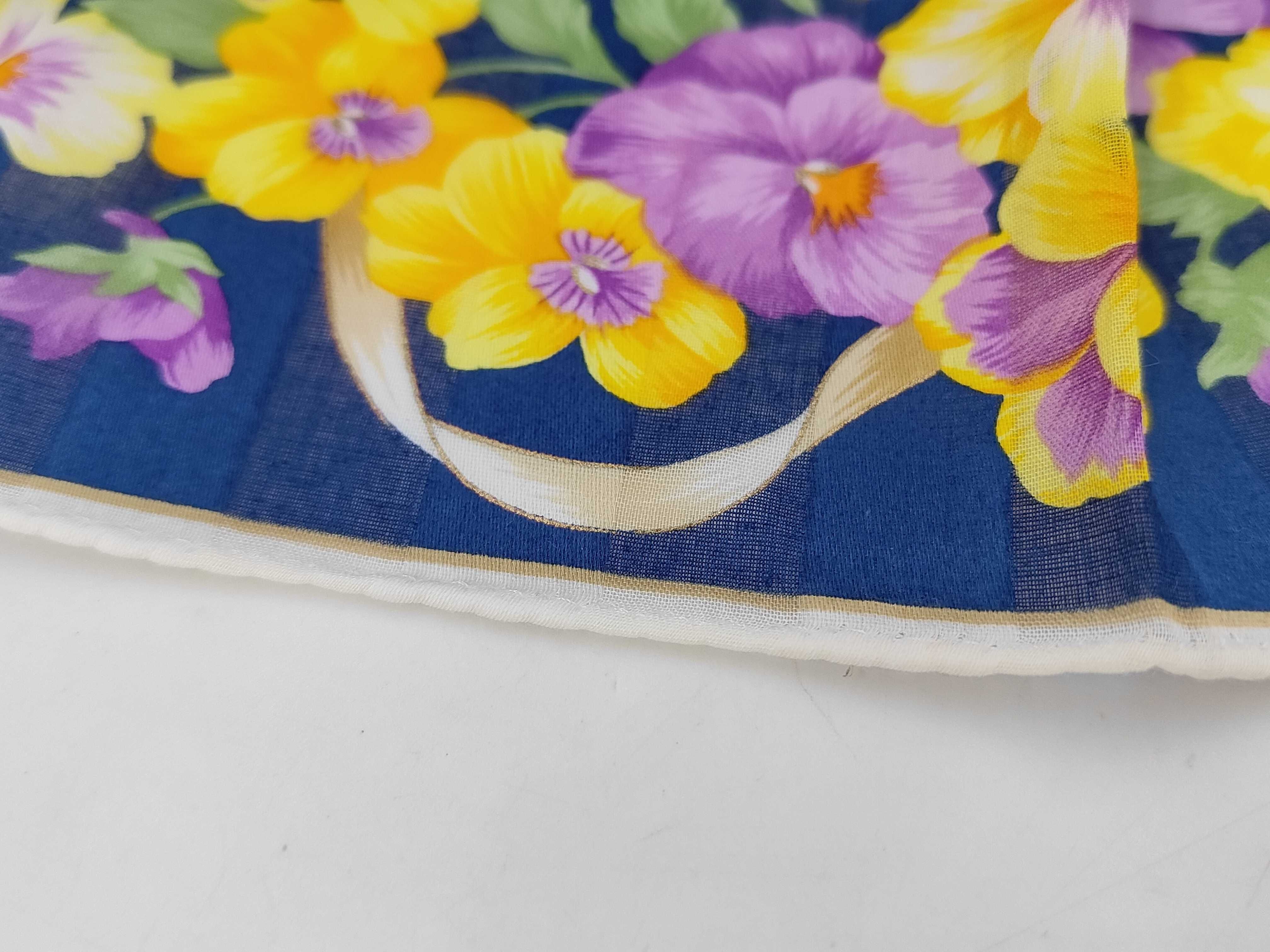 handkerchief scarf with sticker, logo, floral pattern, ribbon, navy, and other accessories. — view 7