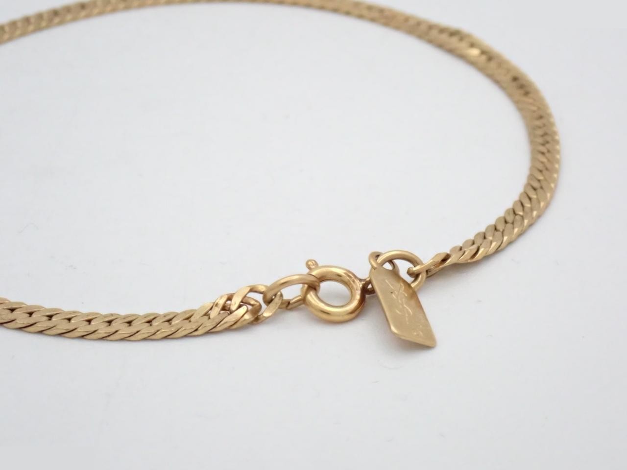 Gold Cuban link chain bracelet by Yves Saint Laurent, wrist circumference approximately 20.5 cm. — view 3