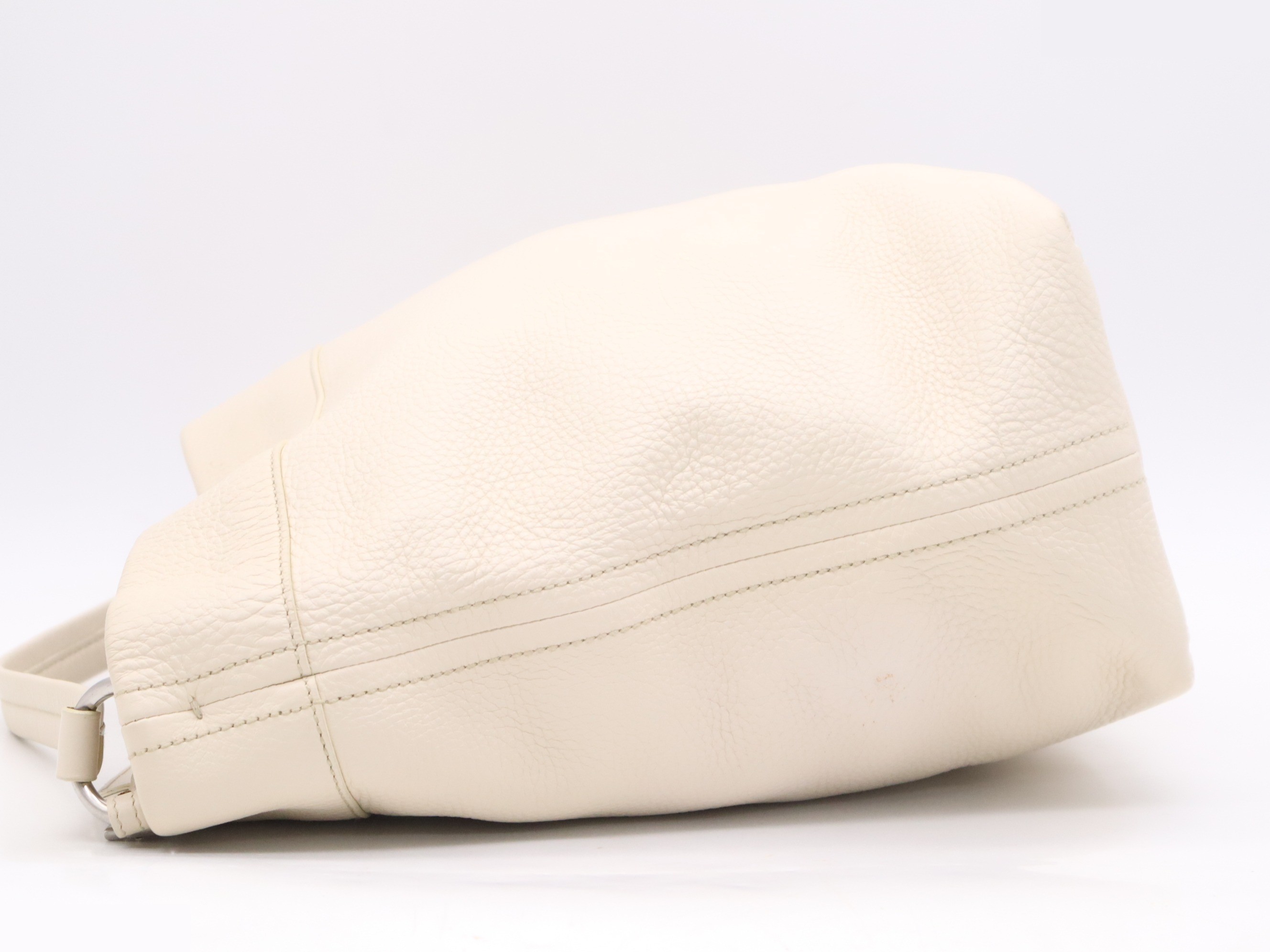 Leather one-shoulder bag, ivory. Includes guarantee card, name tag, and dust bag. — view 3