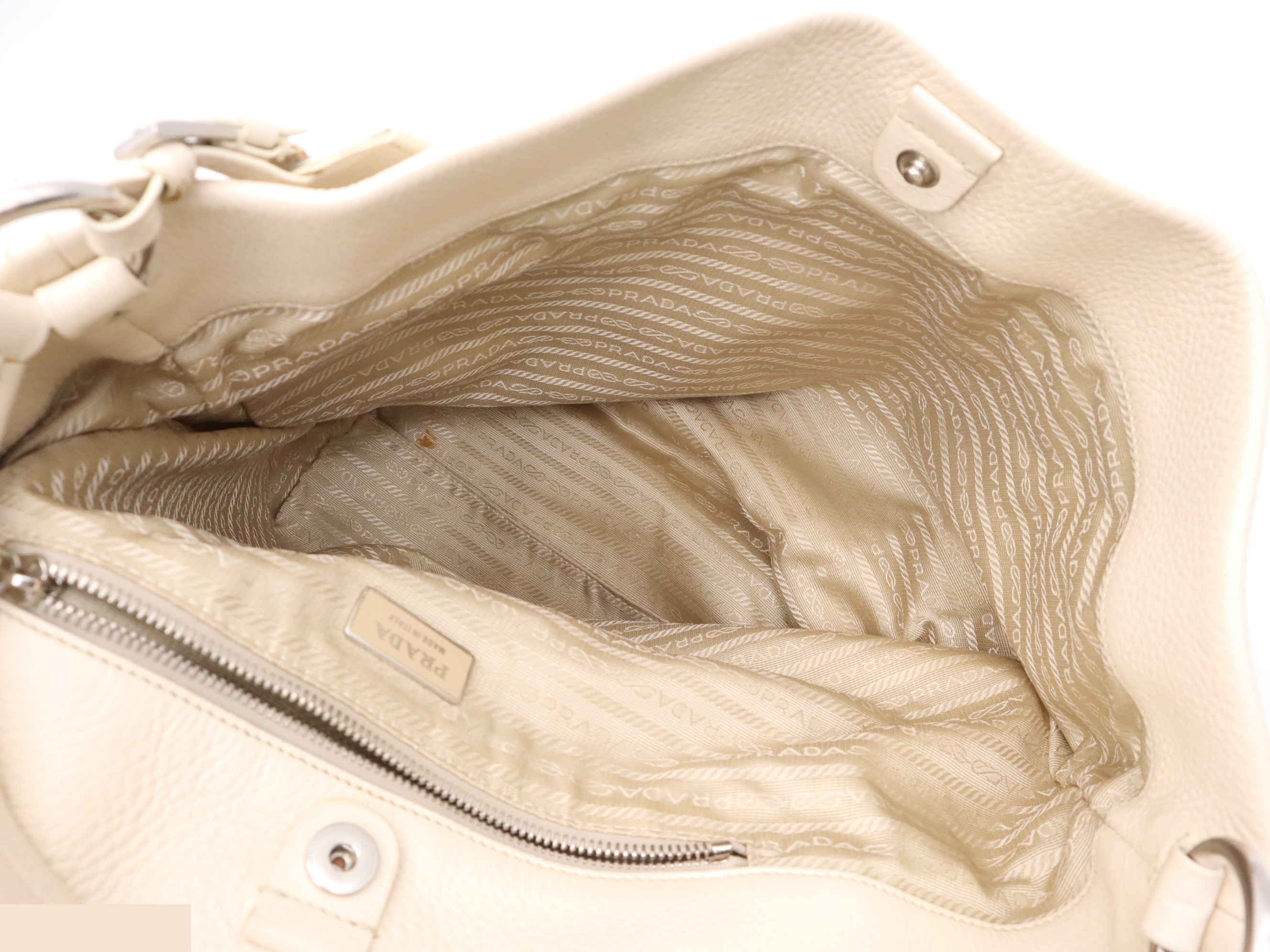 Leather one-shoulder bag, ivory. Includes guarantee card, name tag, and dust bag. — view 7