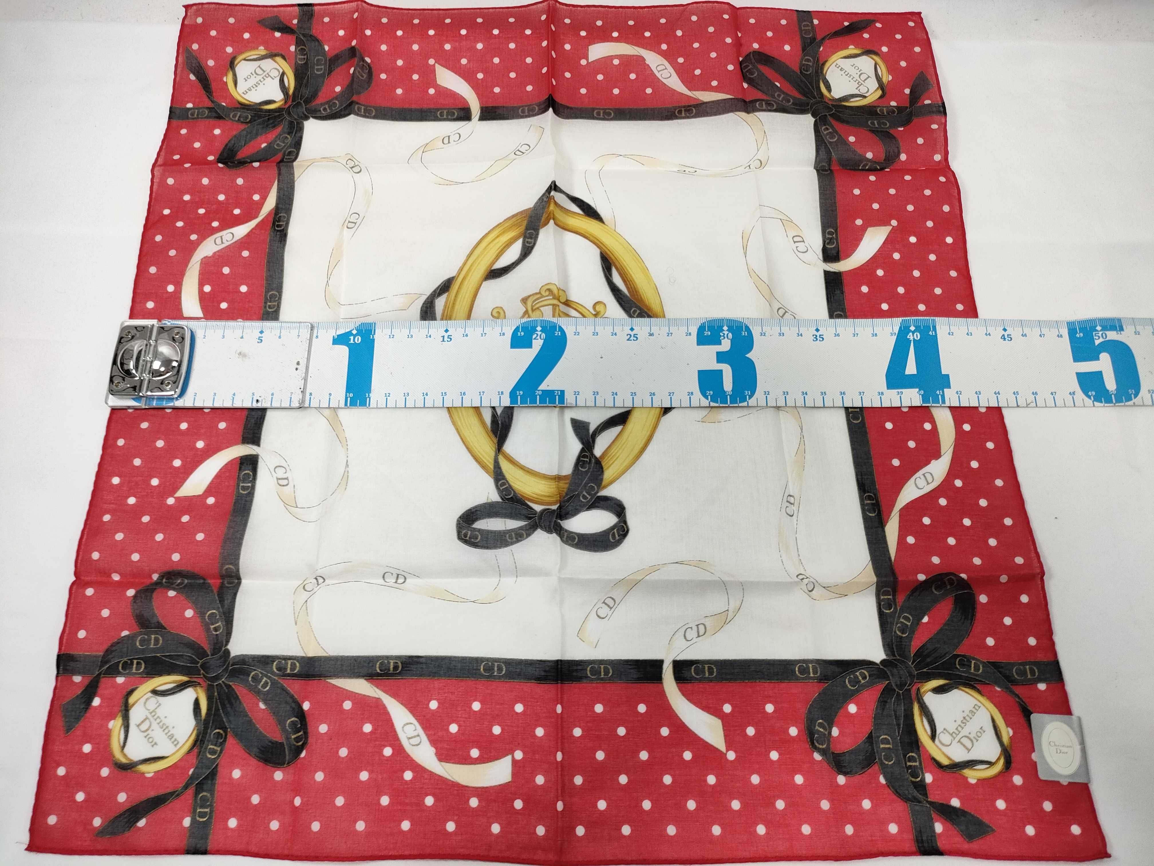 handkerchief scarf with sticker, CD logo, emblem, ribbon, polka dots, and other accessories. — view 2