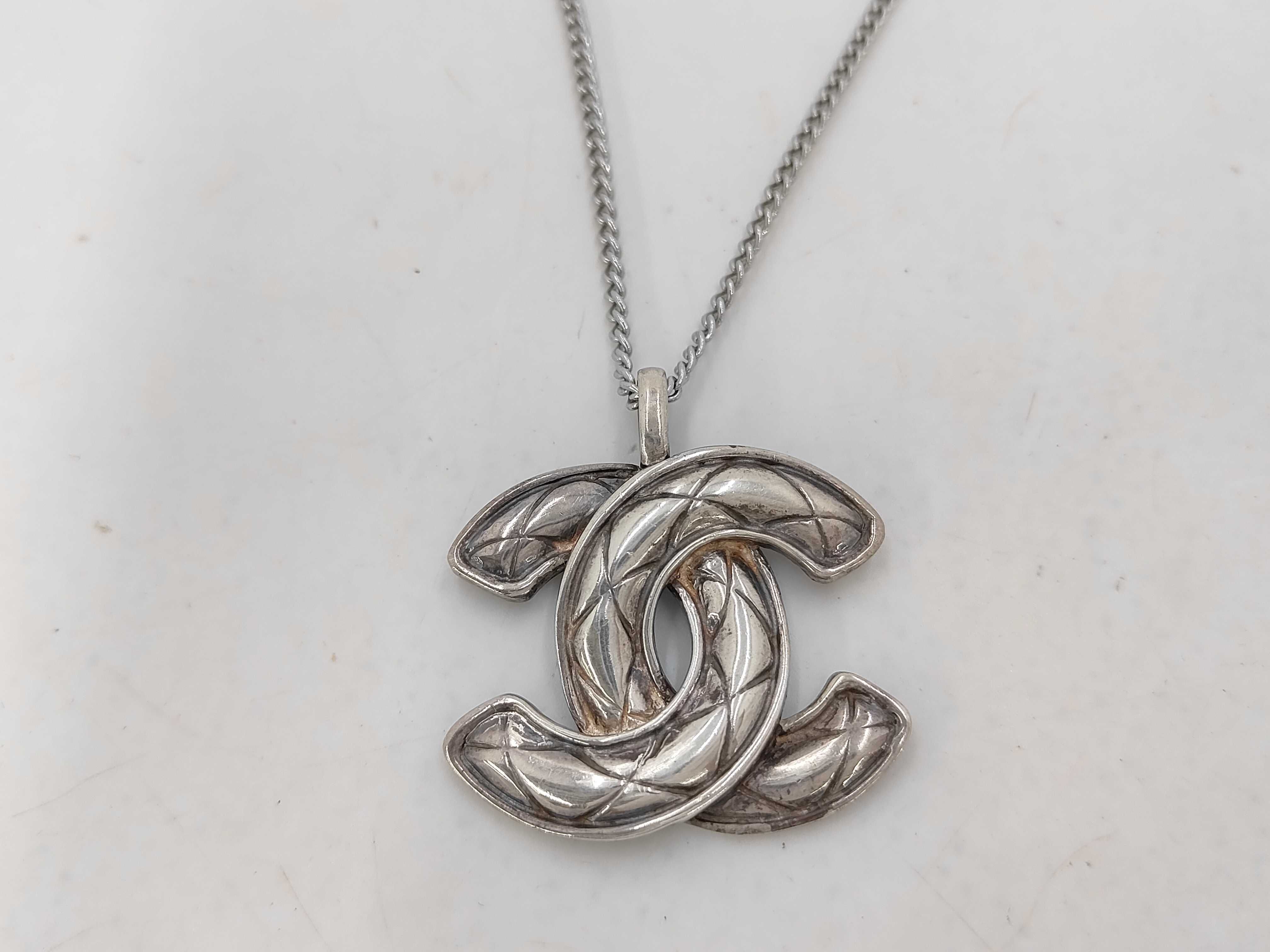 Coco Mark Matelassé Necklace, Silver, with embroidered details, pendant top.