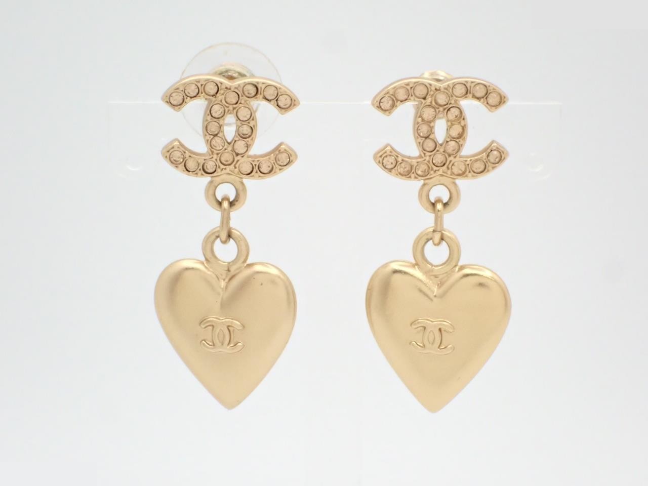 Earrings here mark heart gold