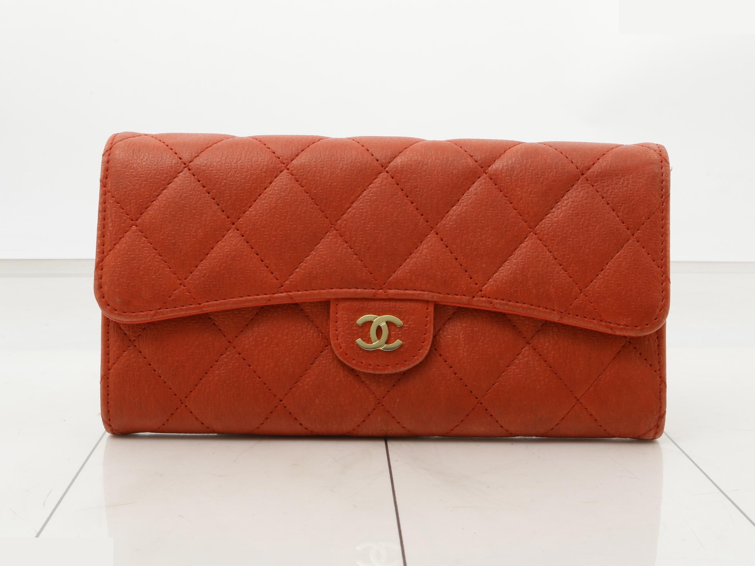 Matelassé calfskin long wallet with embossed logo, serial number 24.