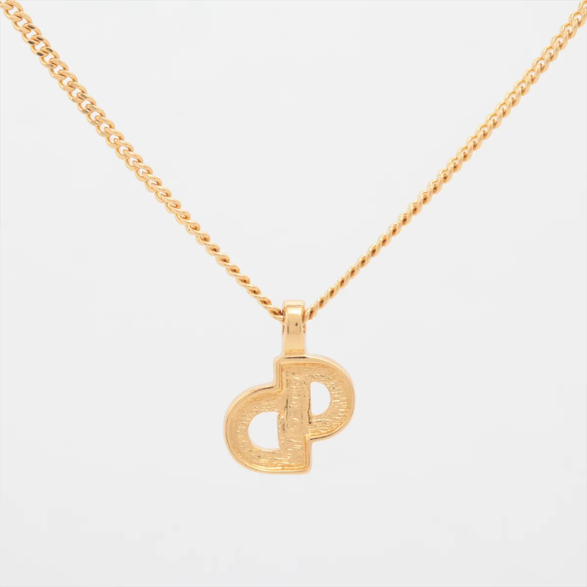 CD logo necklace, gold plated with rhinestones, black and gold. Shows signs of wear, — view 2
