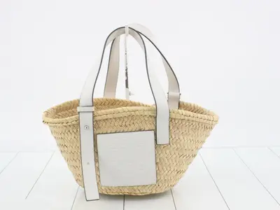Palm leaf and calfskin anagram basket bag, brown, with dust bag.