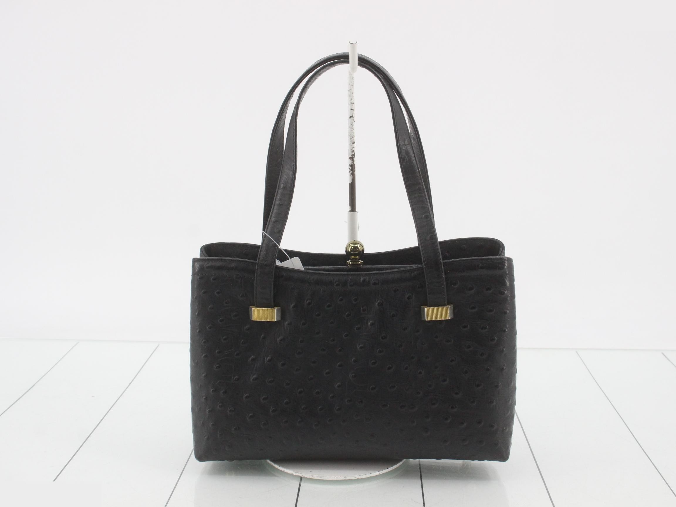 Black ostrich leather handbag with clasp closure. — view 2
