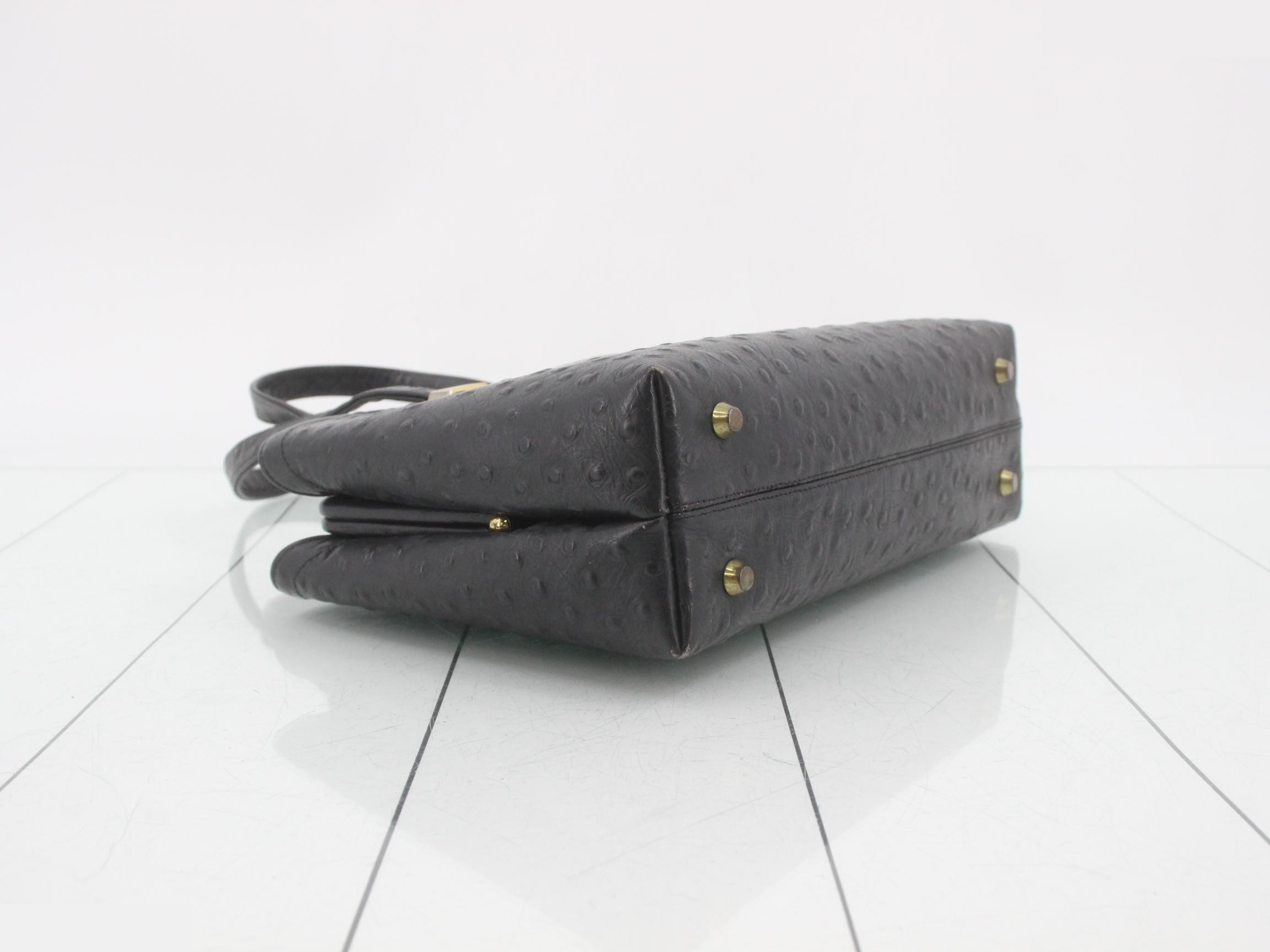 Black ostrich leather handbag with clasp closure. — view 5
