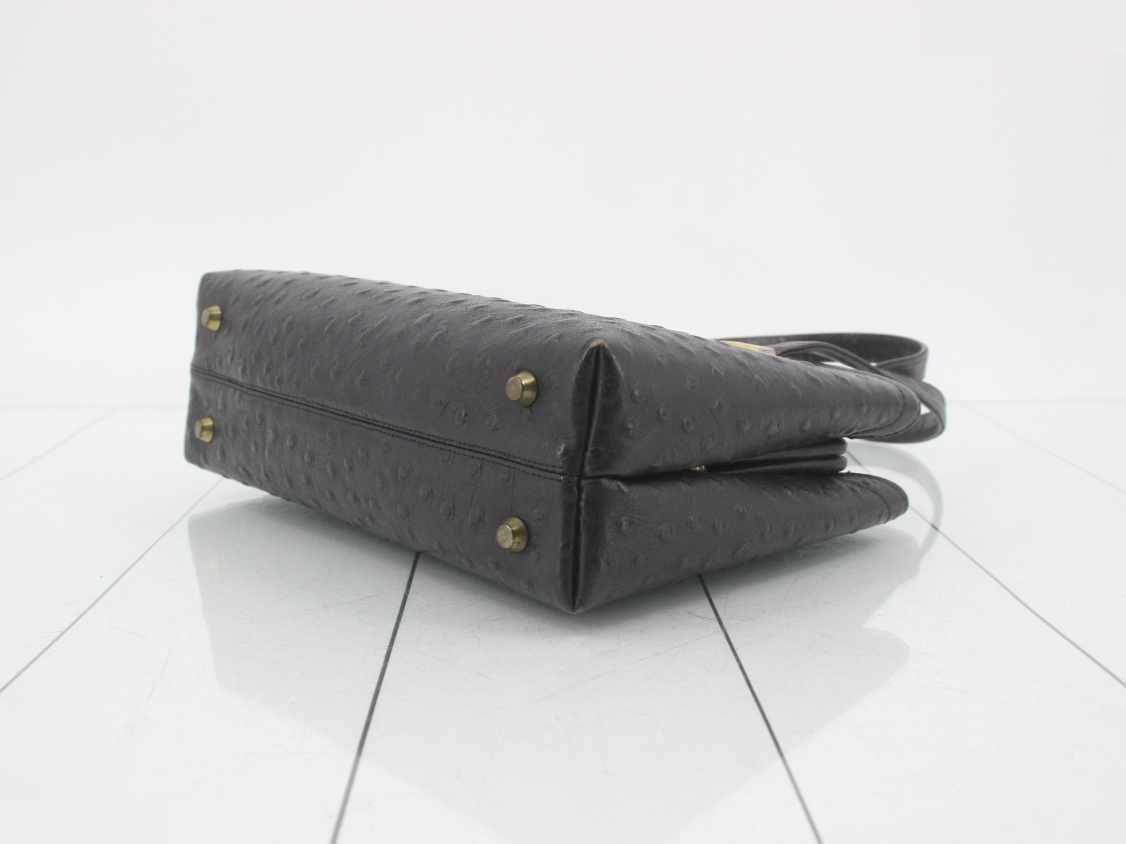 Black ostrich leather handbag with clasp closure. — view 6