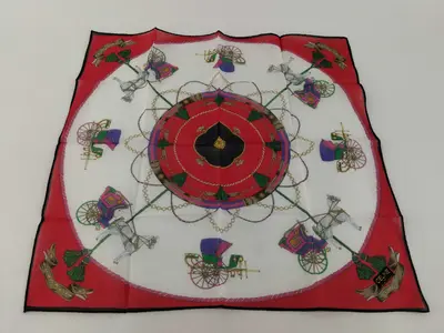 handkerchief scarf with sticker, logo, carriage pattern, red, tassel, and other accessories.