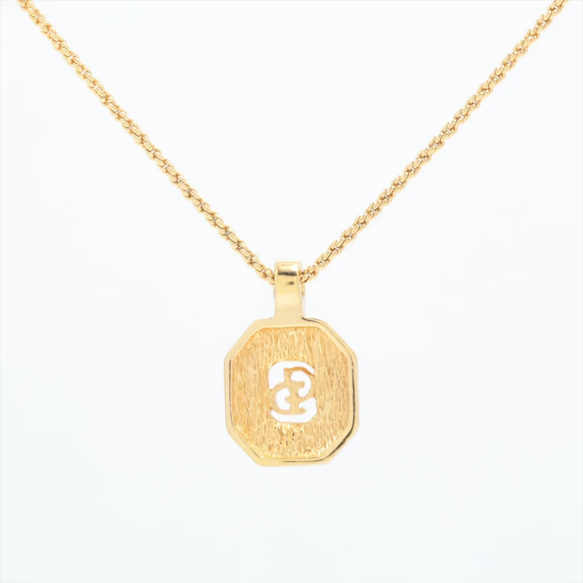 CD logo necklace, gold plated with rhinestones. Shows signs of wear, — view 2