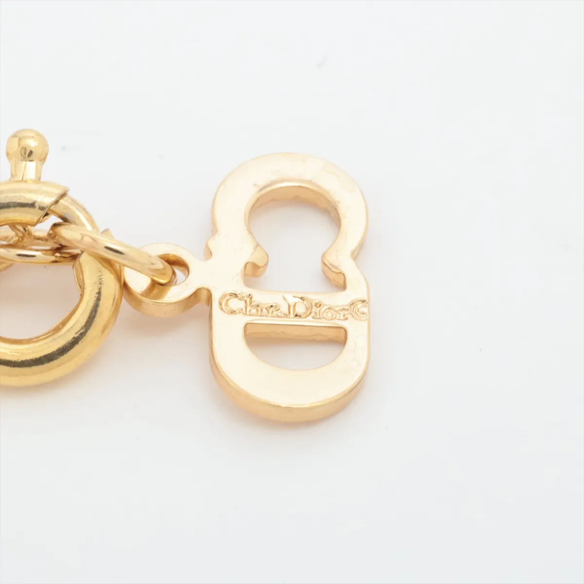 CD logo necklace, gold plated with rhinestones. Shows signs of wear, — view 4