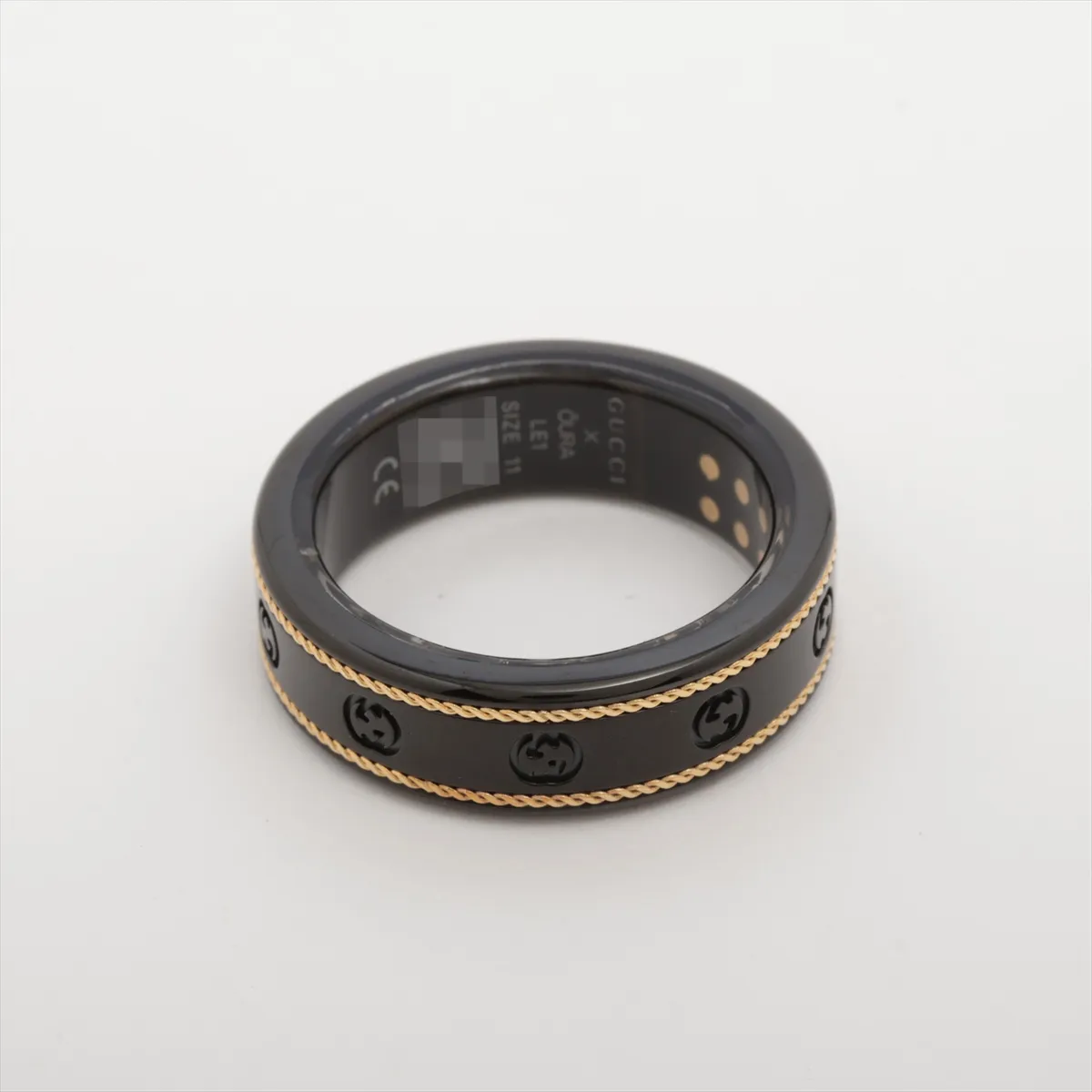 x Aura Interlocking G Ring, Size 11, Titanium, Black x Gold, some wear and tarnishing, cable included. — view 2