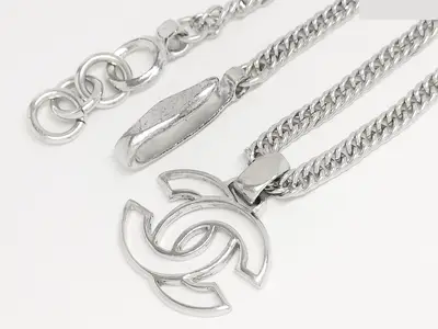Coco carved silver necklace, chain approximately 45cm