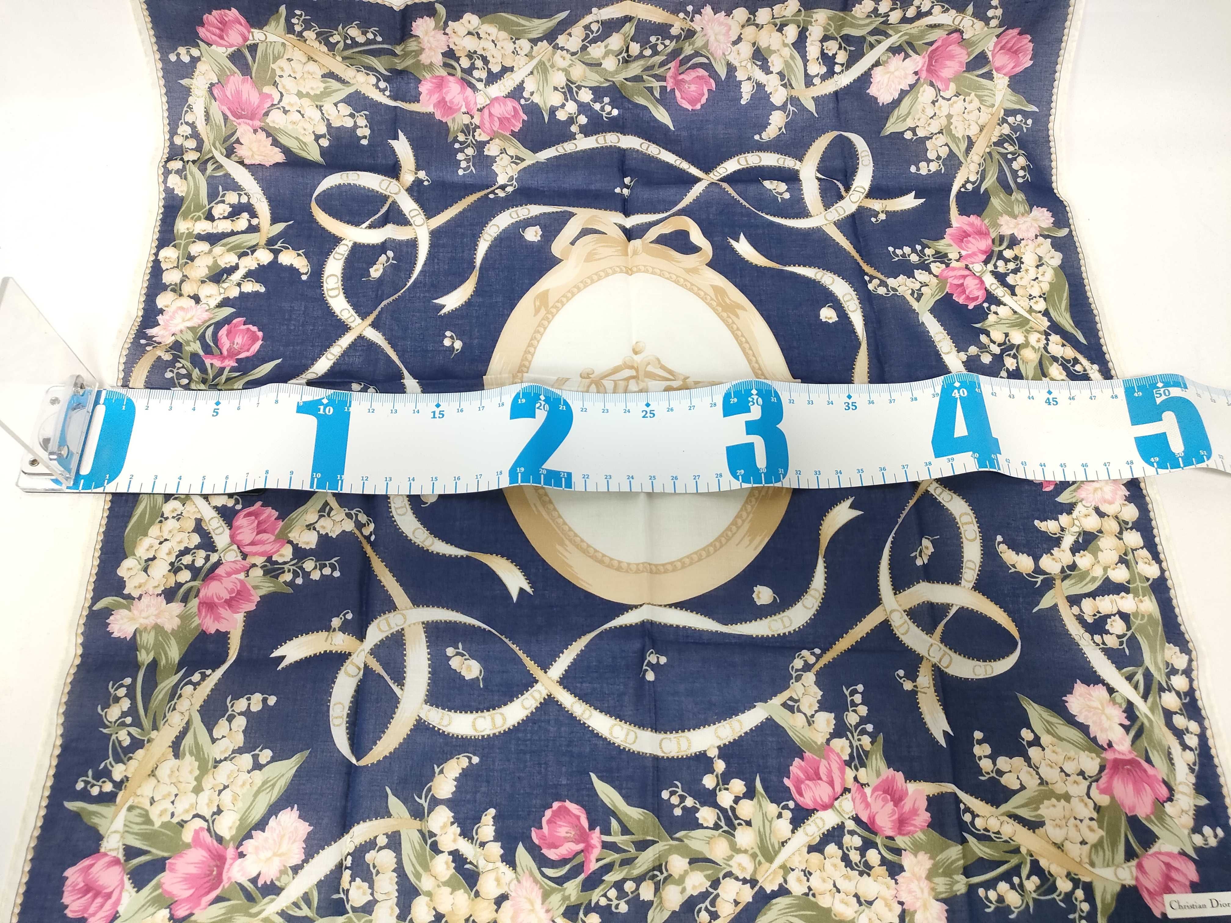 handkerchief scarf with sticker, emblem, ribbon, flower, and other accessories. — view 2