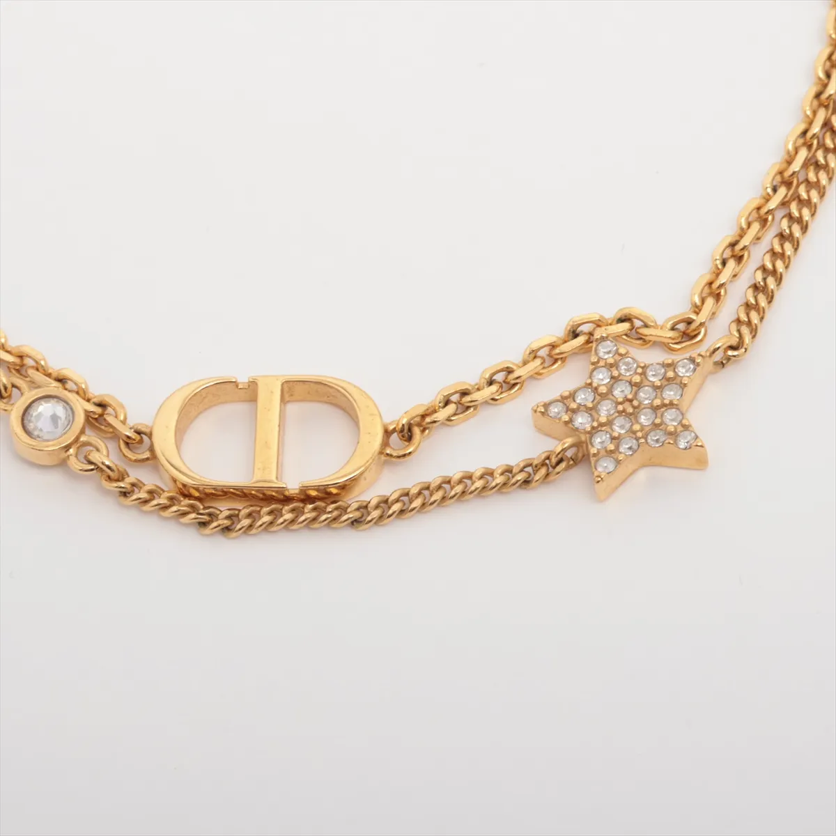 Petit CD bracelet, gold-plated with rhinestones. Shows signs of wear, — view 2