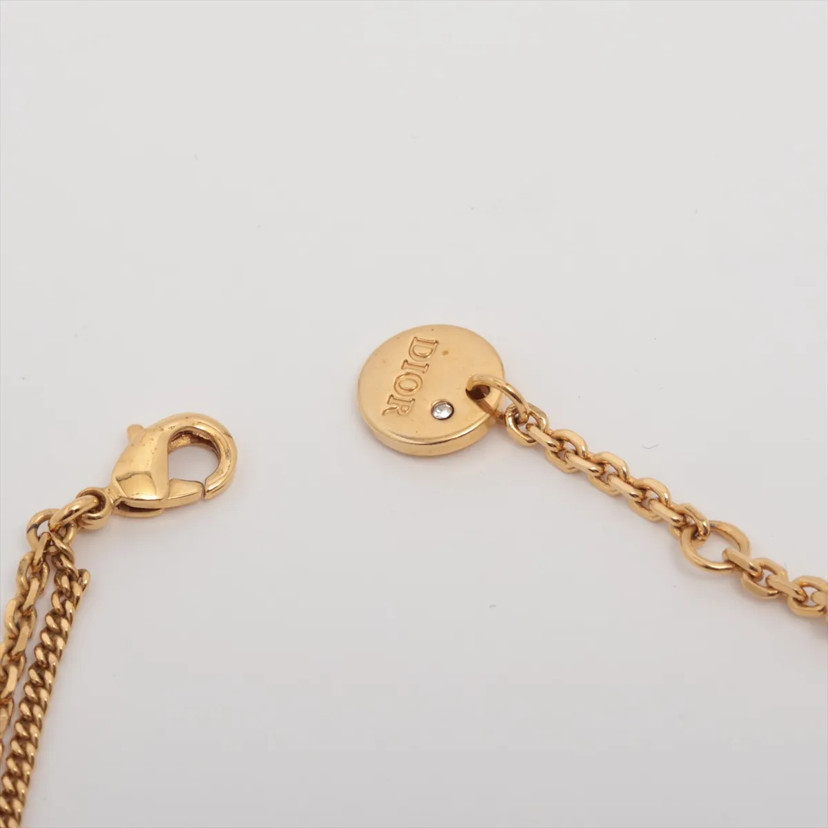 Petit CD bracelet, gold-plated with rhinestones. Shows signs of wear, — view 4