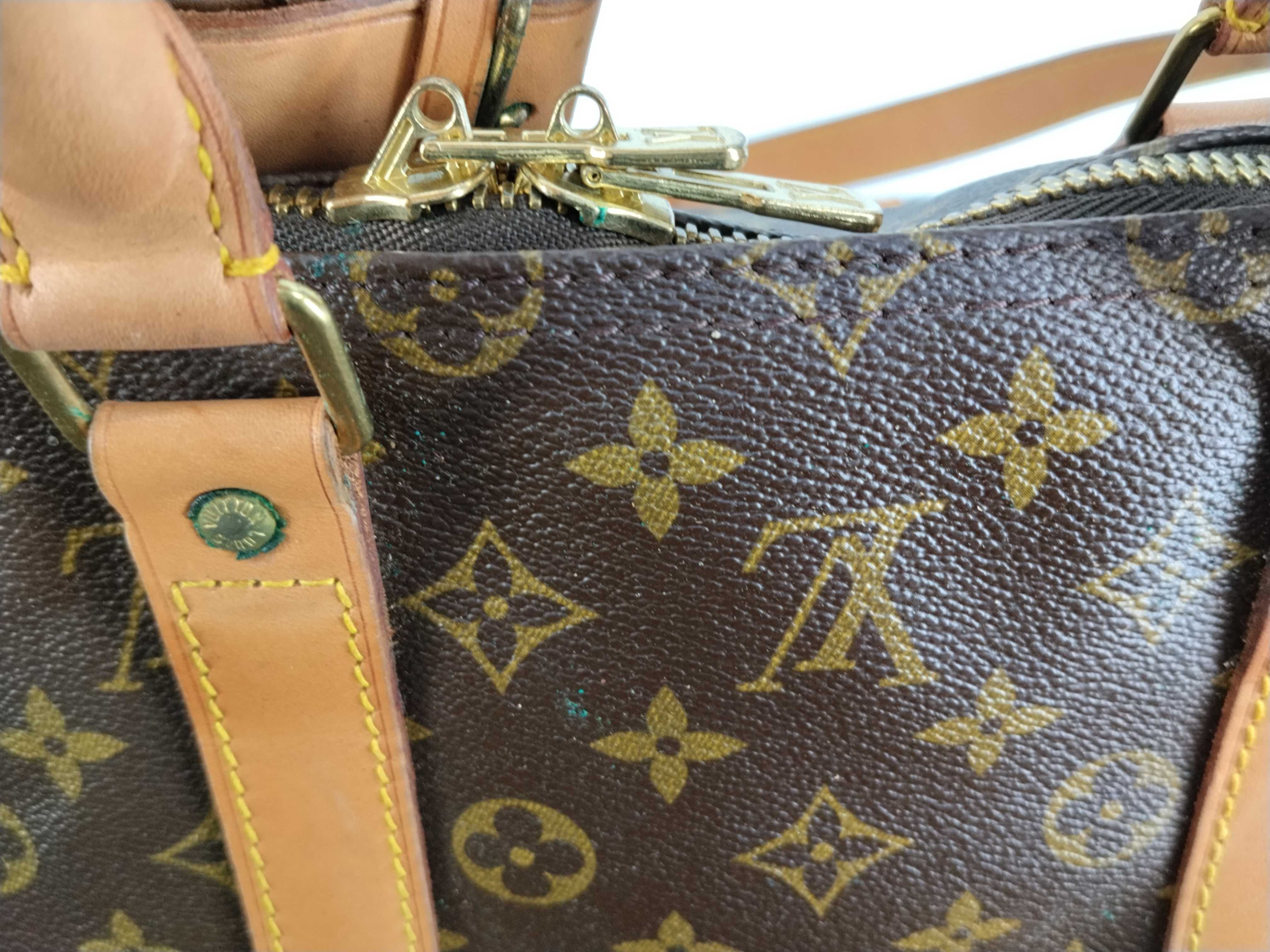 Monogram Keepall 55 Boston bag, bandolier, discoloration, scuffs. — view 11